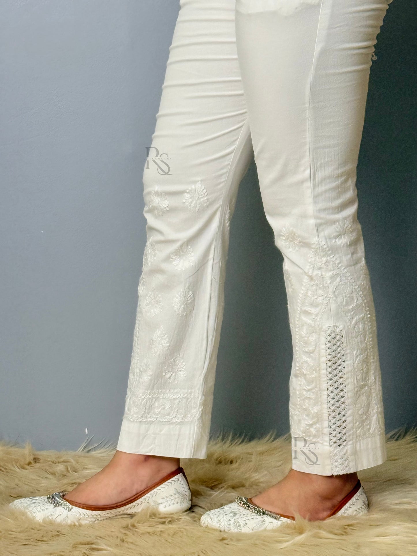 White stretchable cotton chikankari pant with hand embroidery and lace detailing