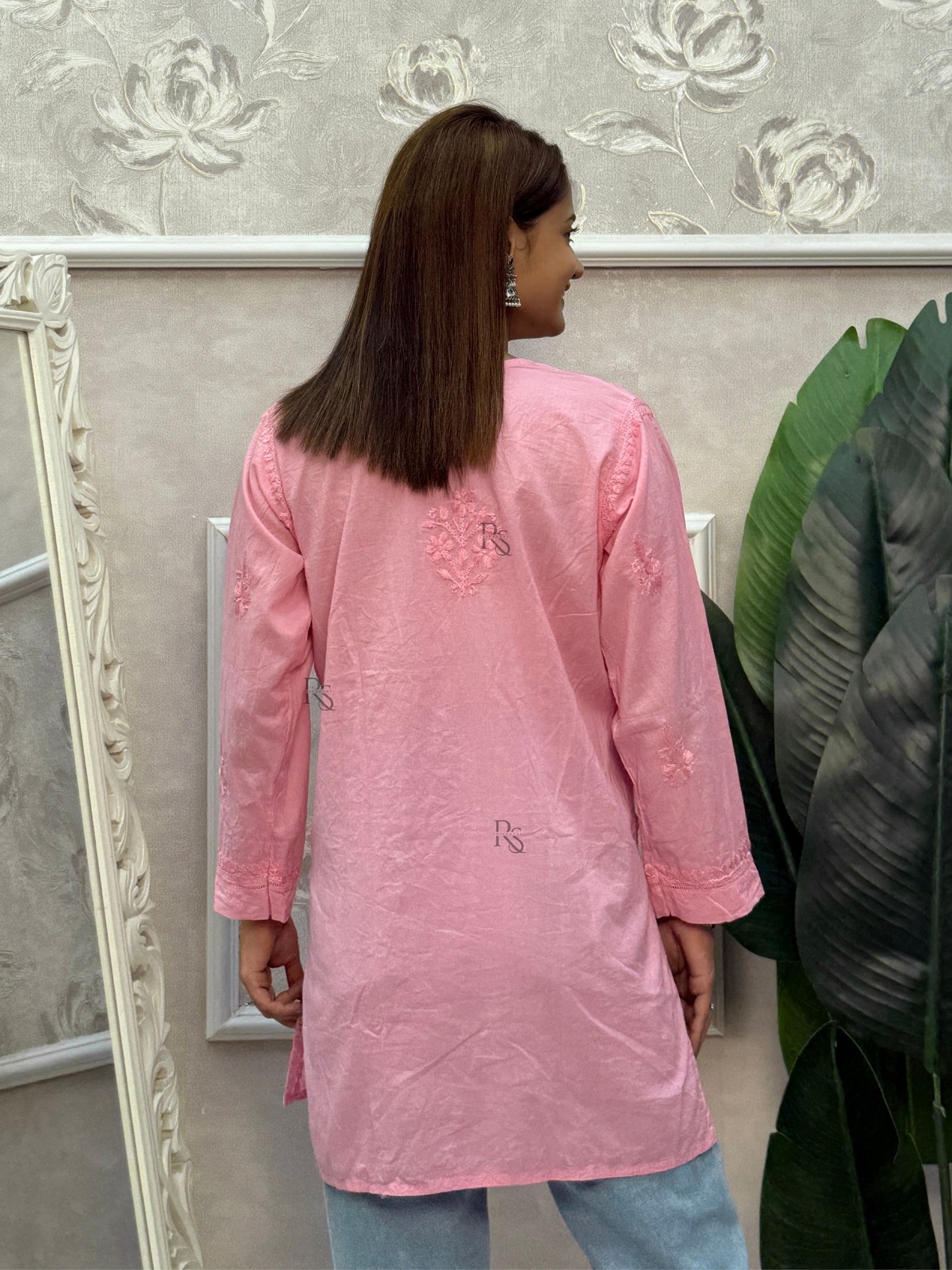 Pink cotton chikankari short kurta with hand embroidery and pockets.
