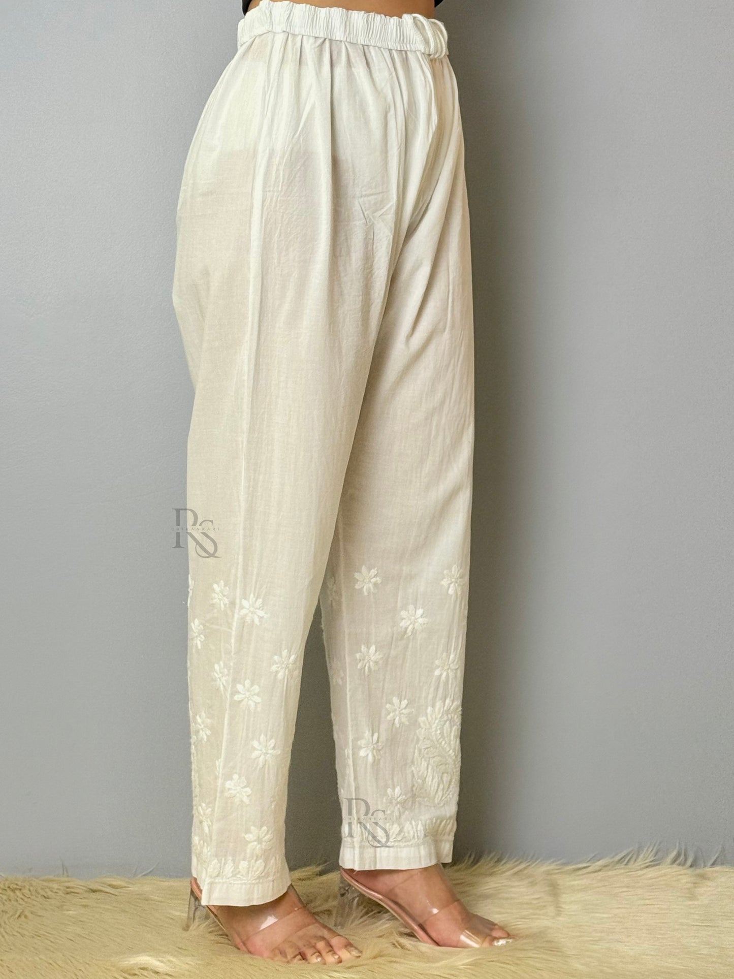White cotton chikankari pant with intricate floral embroidery, non-stretchable and dyable