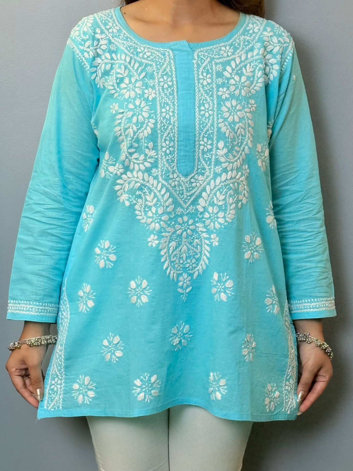 Sky blue cotton short chikankari kurta with white hand embroidery, styled for casual wear