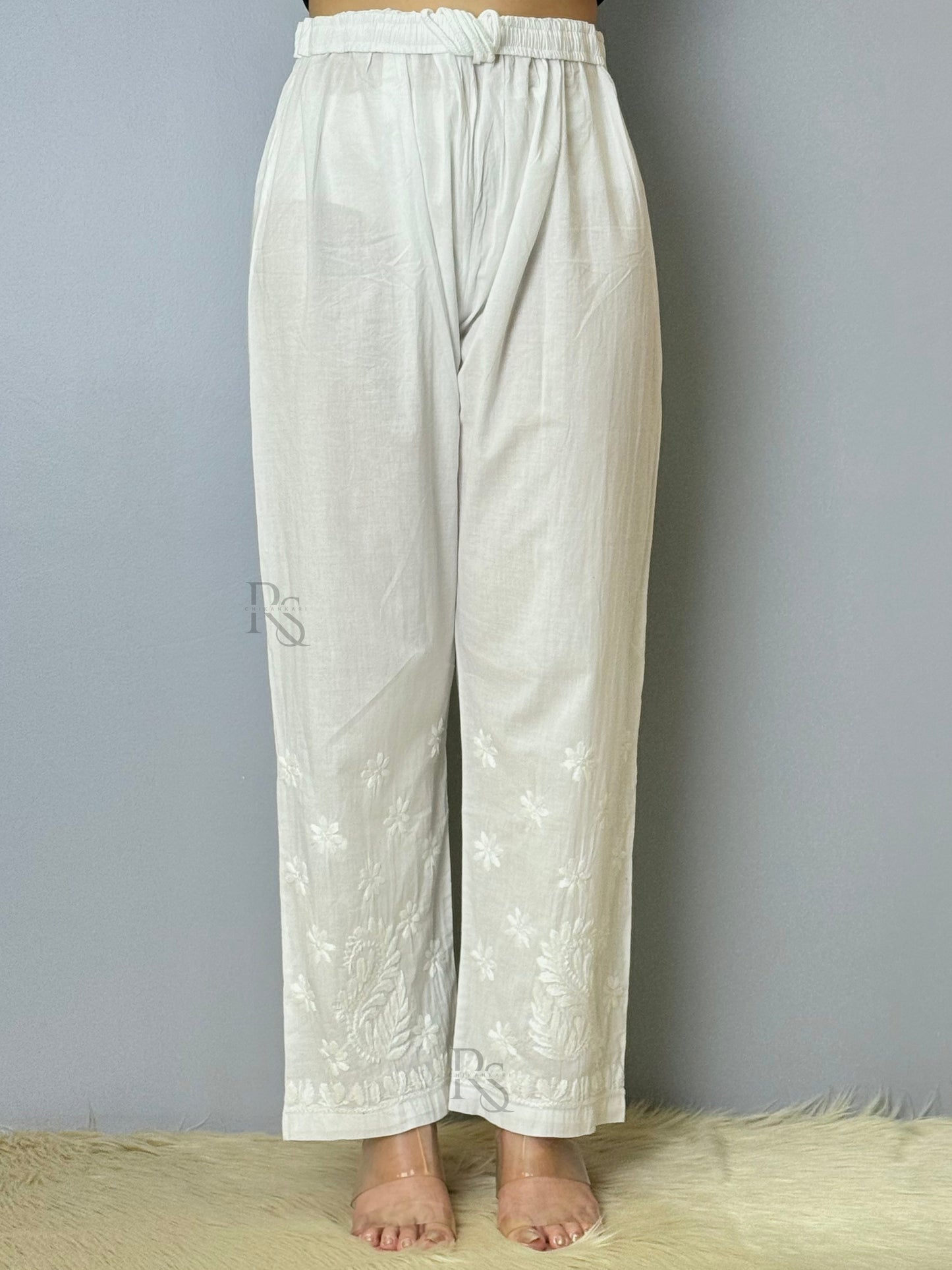 White cotton chikankari pant with intricate floral embroidery, non-stretchable and dyable