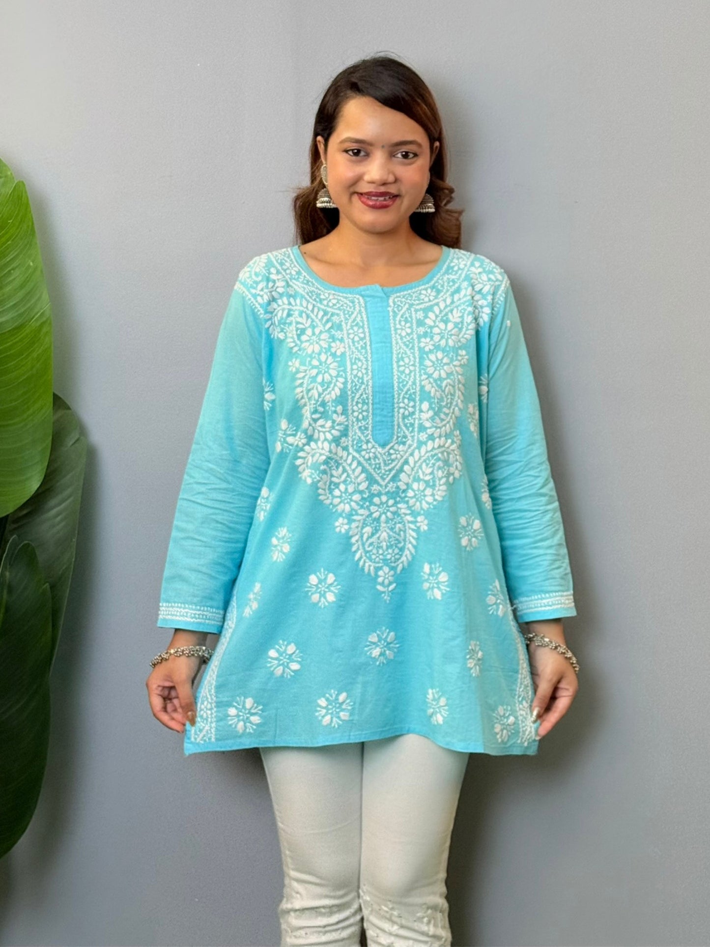 Sky blue cotton short chikankari kurta with white hand embroidery, styled for casual wear