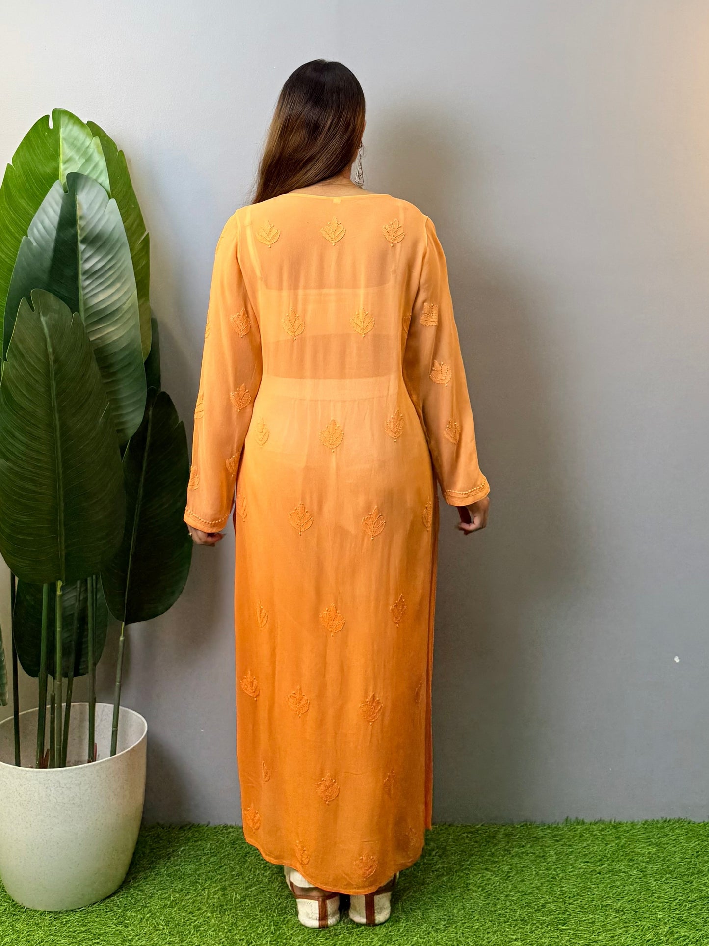 Orange viscose Lucknow Chikankari kurta with intricate hand embroidery, elegant and comfortable ethnic wear.