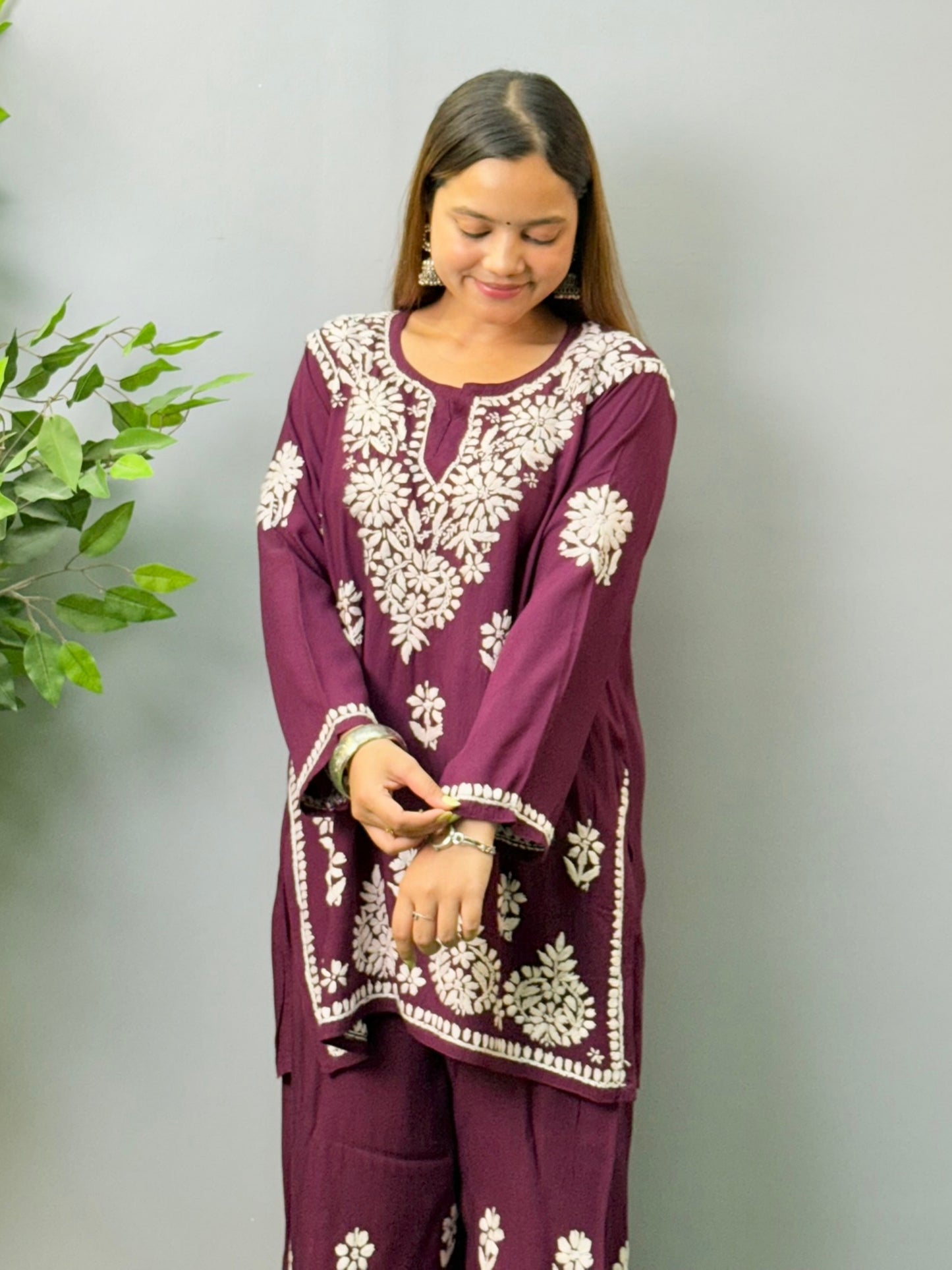 Model wearing plum wine Lucknow Chikankari short kurta and palazzo co-ord set in rayon fabric