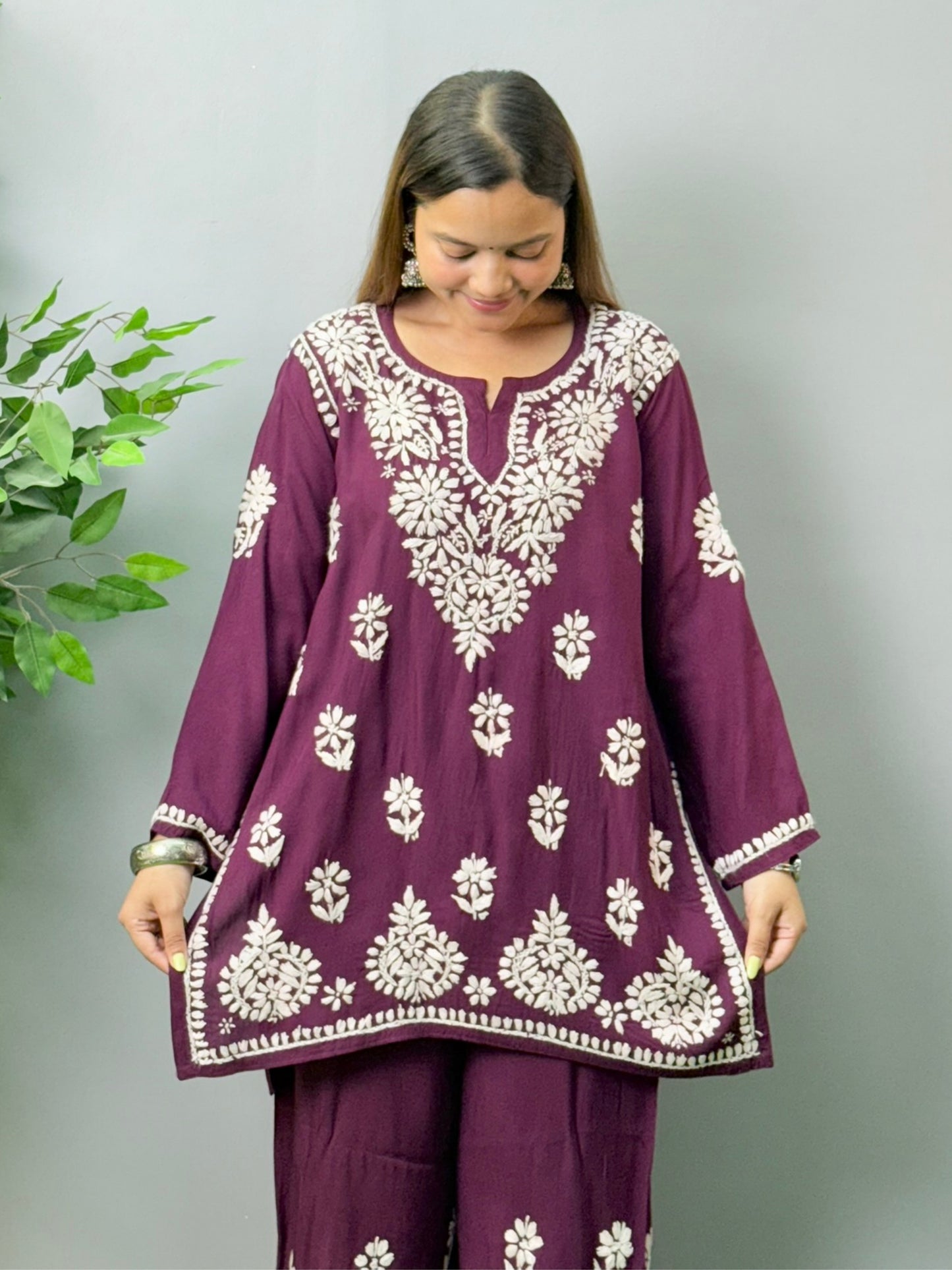 Model wearing plum wine Lucknow Chikankari short kurta and palazzo co-ord set in rayon fabric