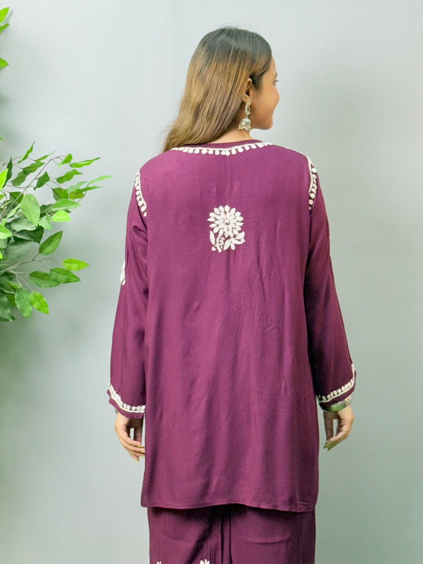 Model wearing plum wine Lucknow Chikankari short kurta and palazzo co-ord set in rayon fabric