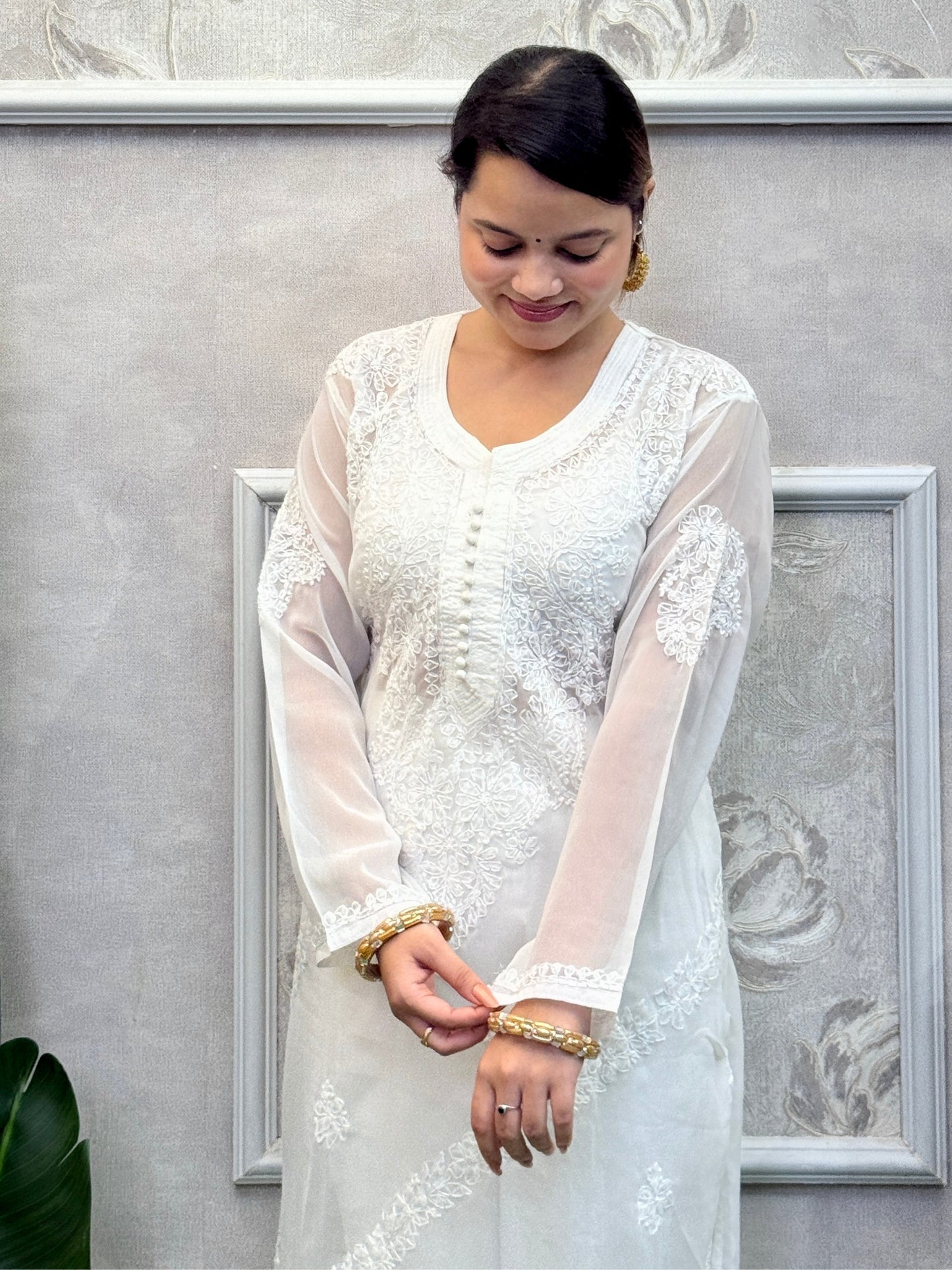 White georgette Lucknow chikankari kurta with delicate hand embroidery, soft and elegant design.