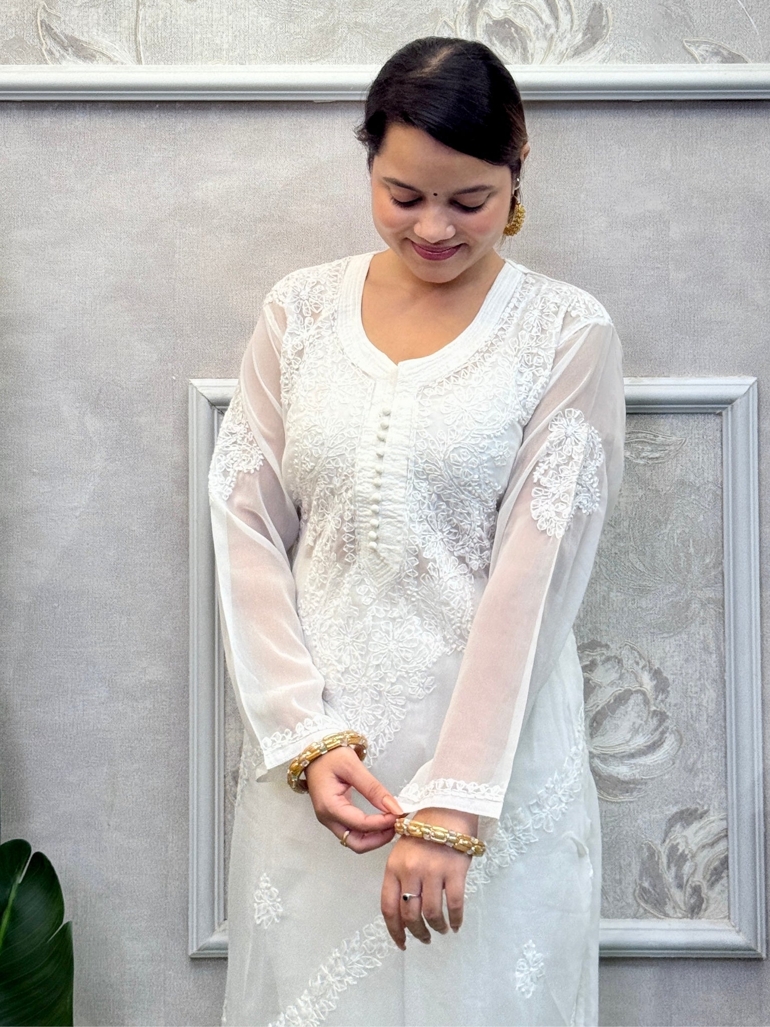 White georgette Lucknow chikankari kurta with delicate hand embroidery, soft and elegant design.