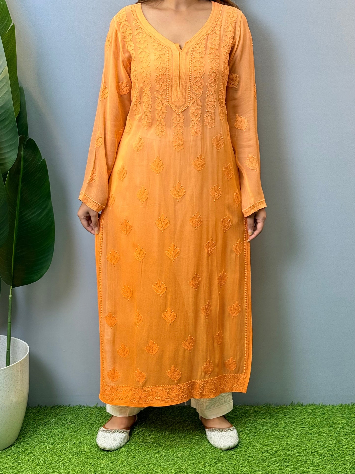 Orange viscose Lucknow Chikankari kurta with intricate hand embroidery, elegant and comfortable ethnic wear.