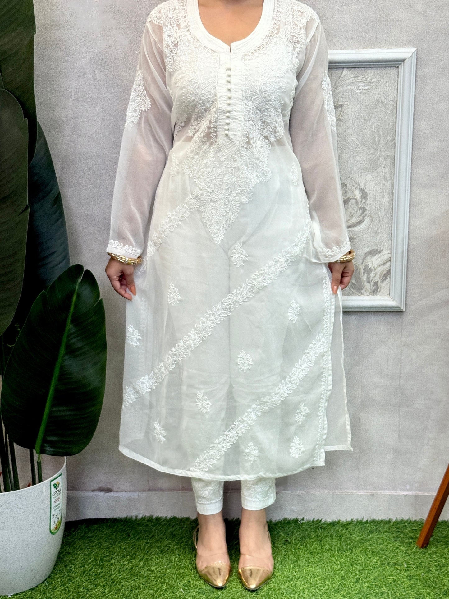 White georgette Lucknow chikankari kurta with delicate hand embroidery, soft and elegant design.