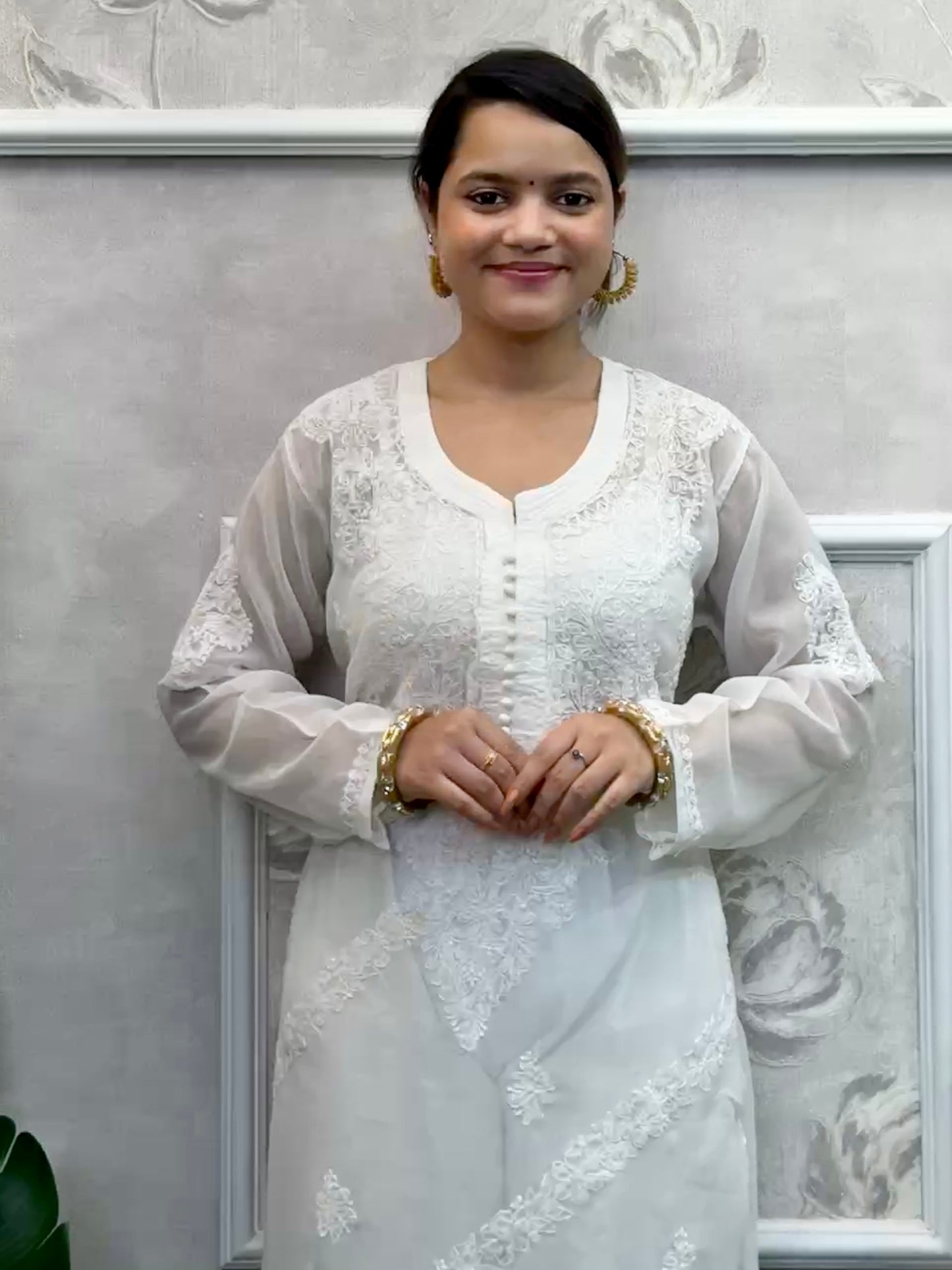 White georgette Lucknow chikankari kurta with delicate hand embroidery, soft and elegant design.