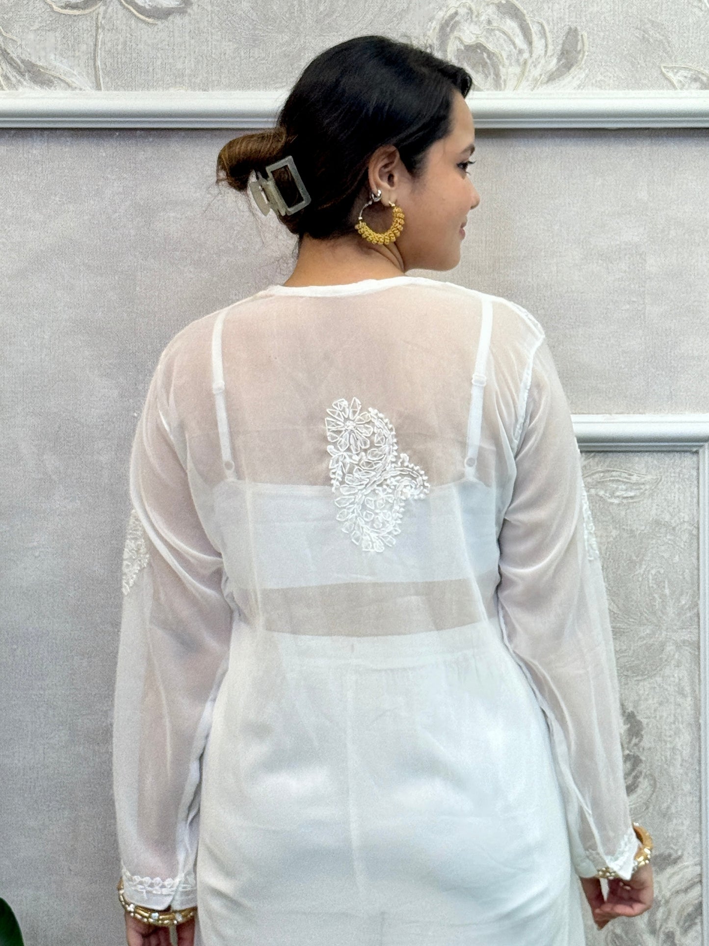 White georgette Lucknow chikankari kurta with delicate hand embroidery, soft and elegant design.