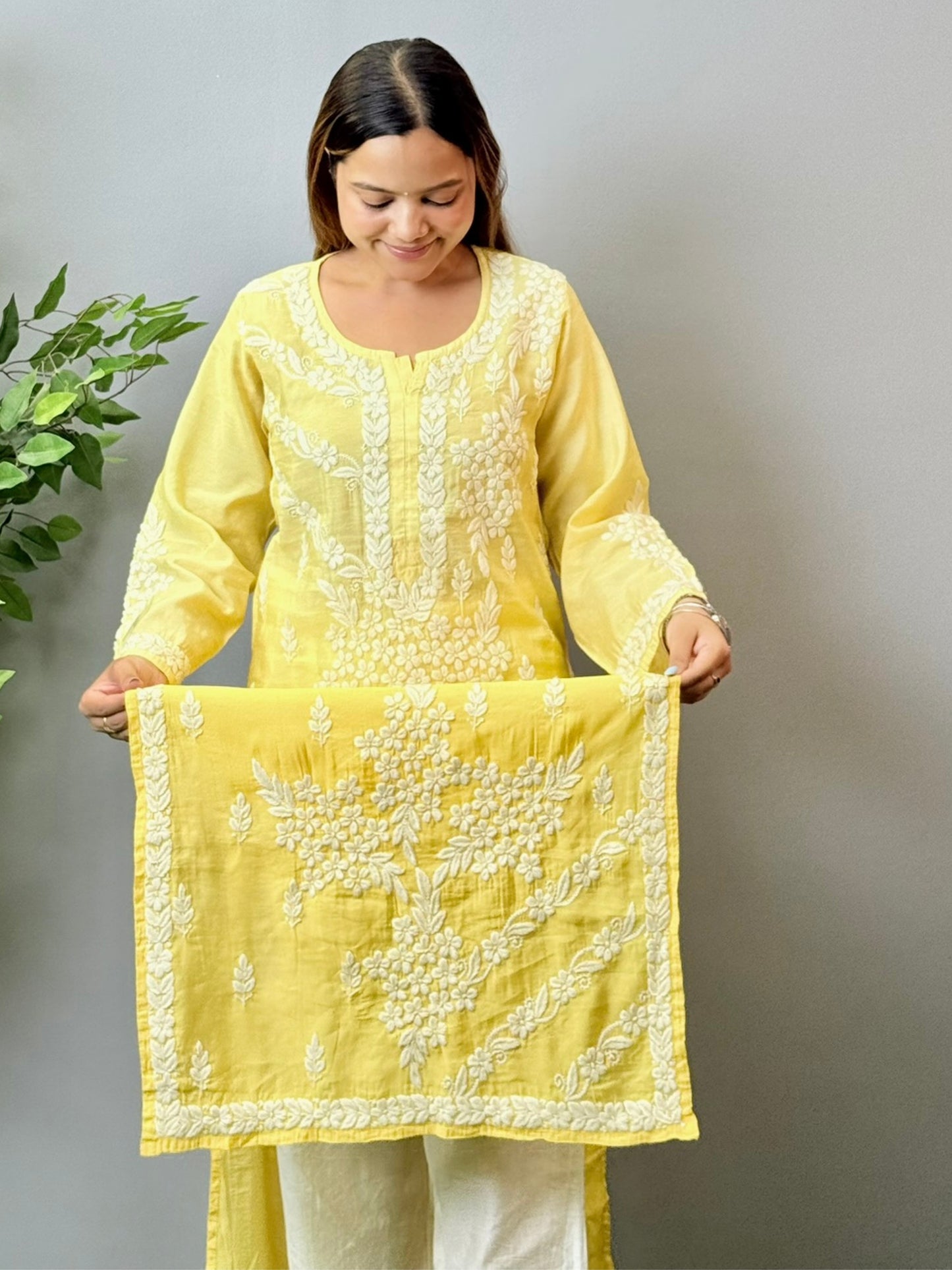 Model wearing a yellow ombre chanderi chikankari kurta with intricate 3D hand embroidery
