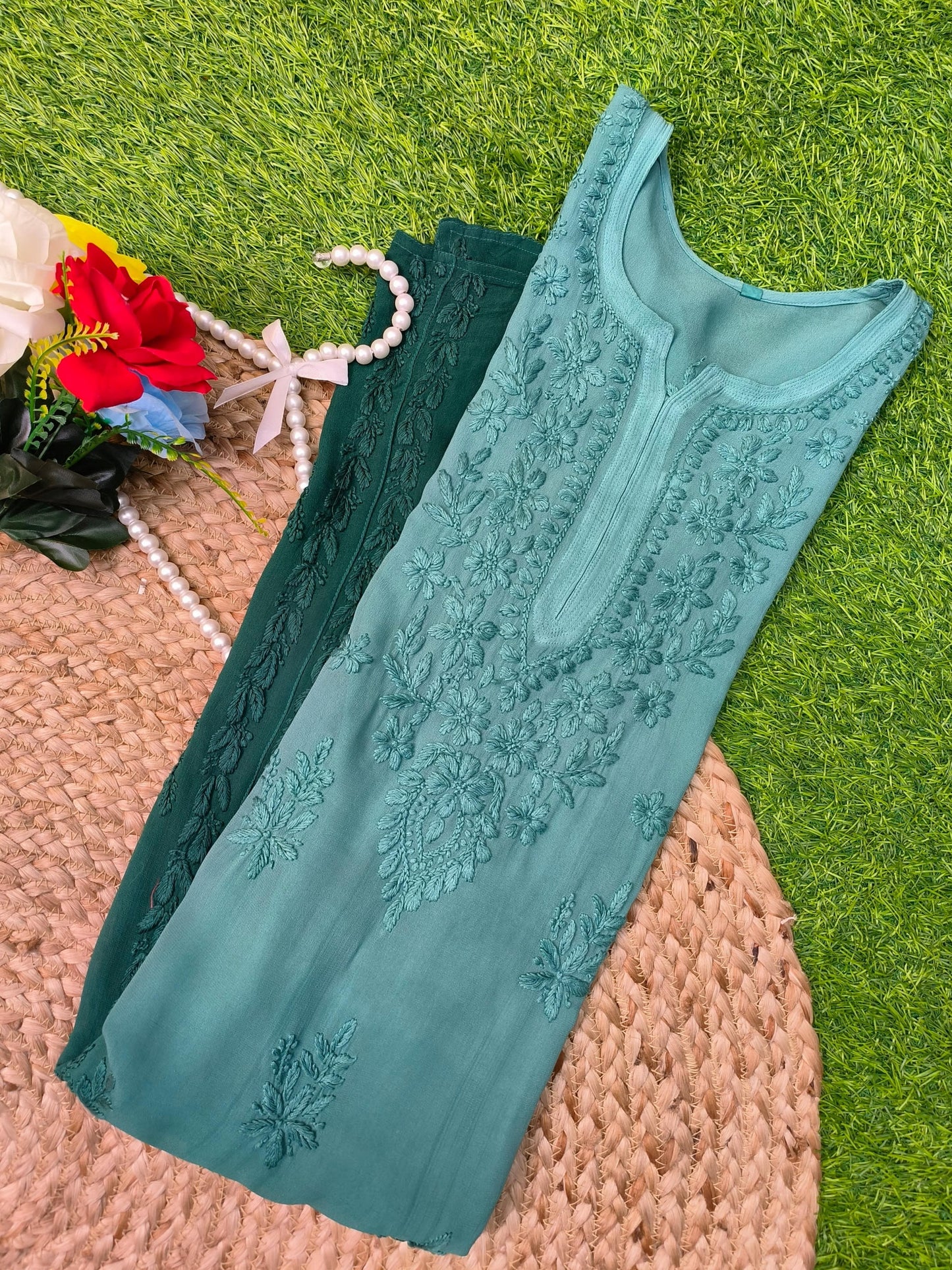 Flat lay of premium viscose Lucknowi Chikankari ombre kurta in teal to deep sea green shades with tone-on-tone embroidery, by R S CHIKANKARI.