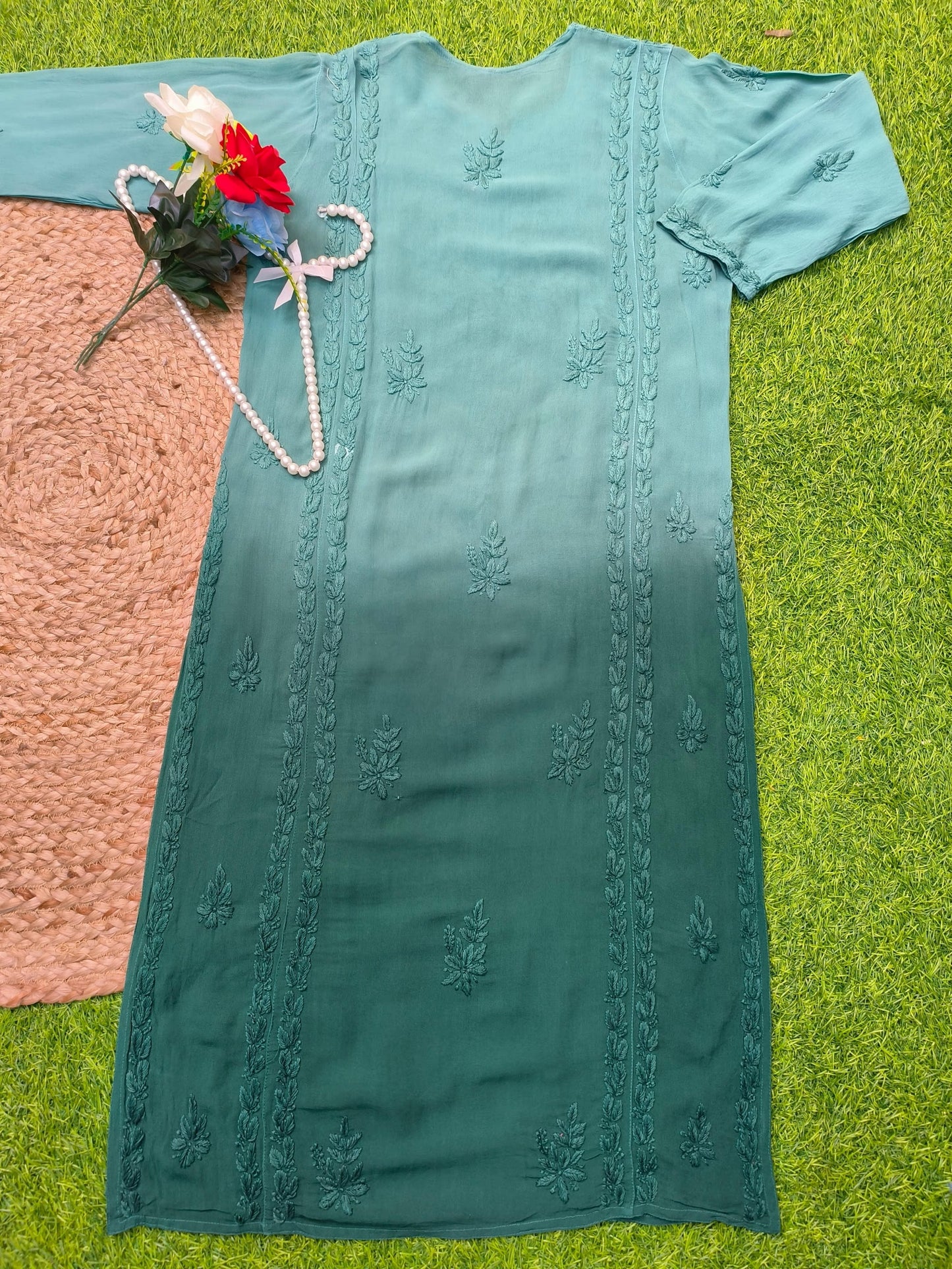 Flat lay of premium viscose Lucknowi Chikankari ombre kurta in teal to deep sea green shades with tone-on-tone embroidery, by R S CHIKANKARI.