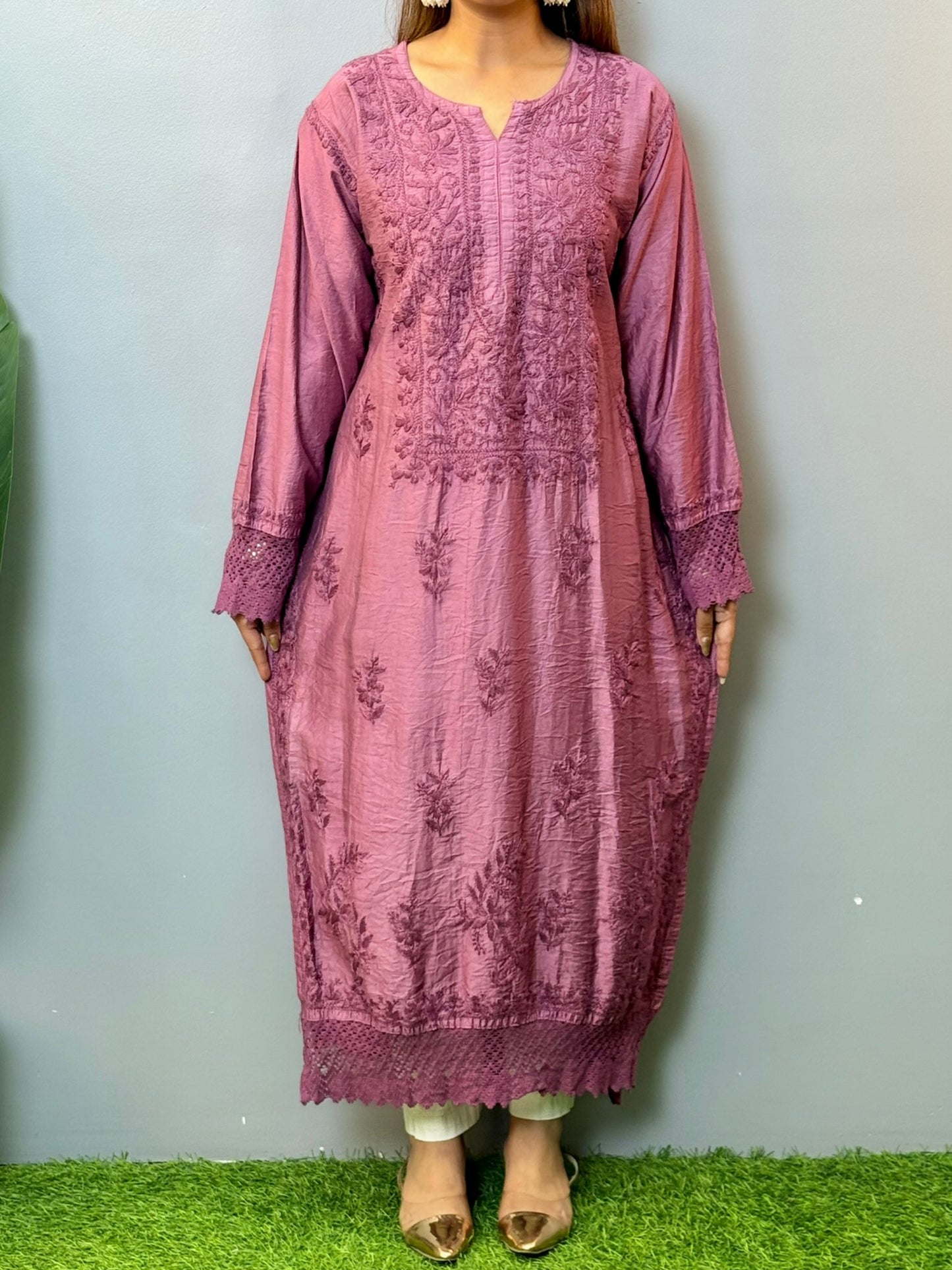 Woman wearing a plum Chanderi Chikankari kurta with hand embroidery and lace detailing, styled with white palazzo pants
