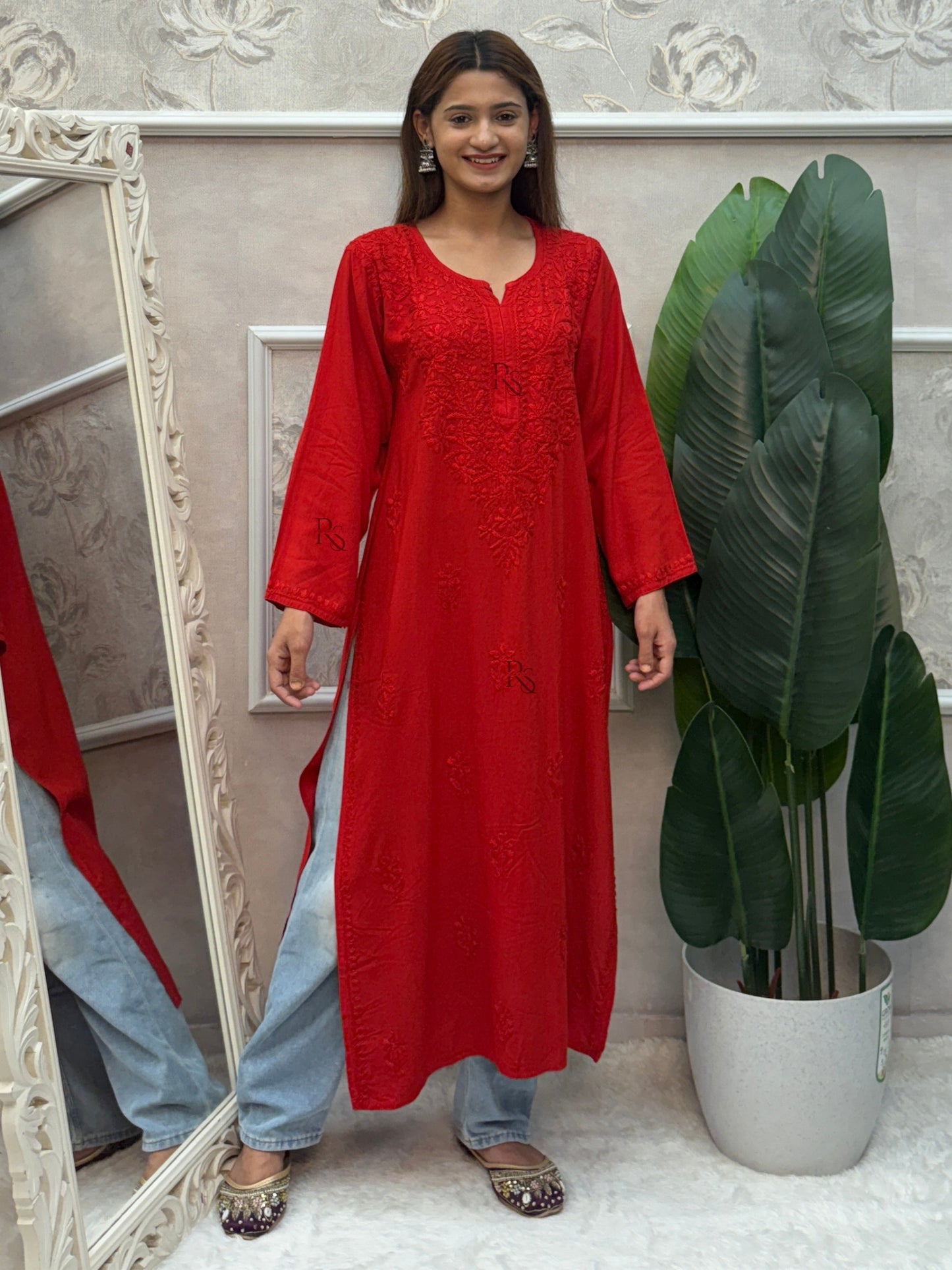 Red rayon Lucknow Chikankari kurta with intricate hand embroidery.