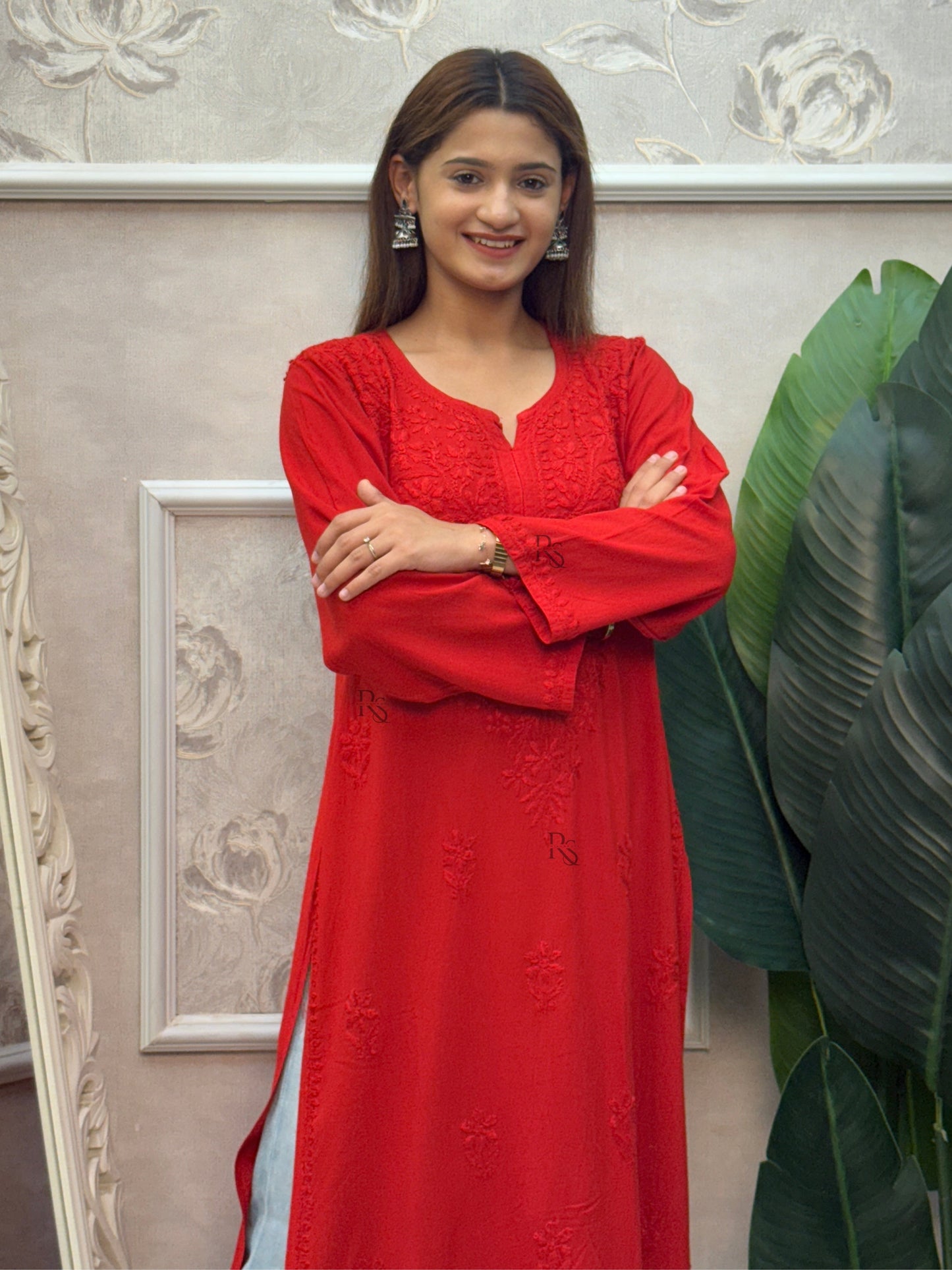 Red rayon Lucknow Chikankari kurta with intricate hand embroidery.
