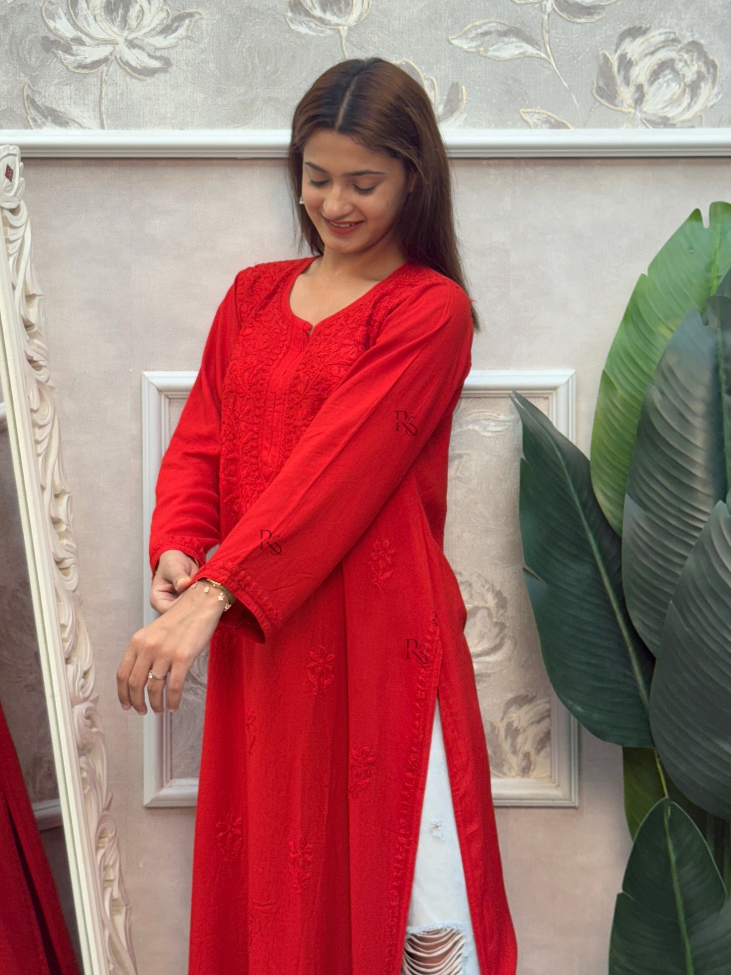Red rayon Lucknow Chikankari kurta with intricate hand embroidery.