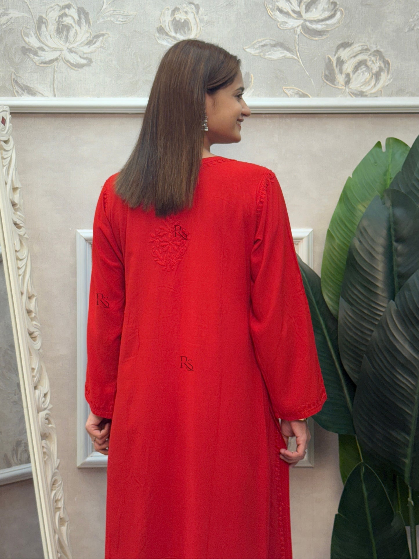 Red rayon Lucknow Chikankari kurta with intricate hand embroidery.