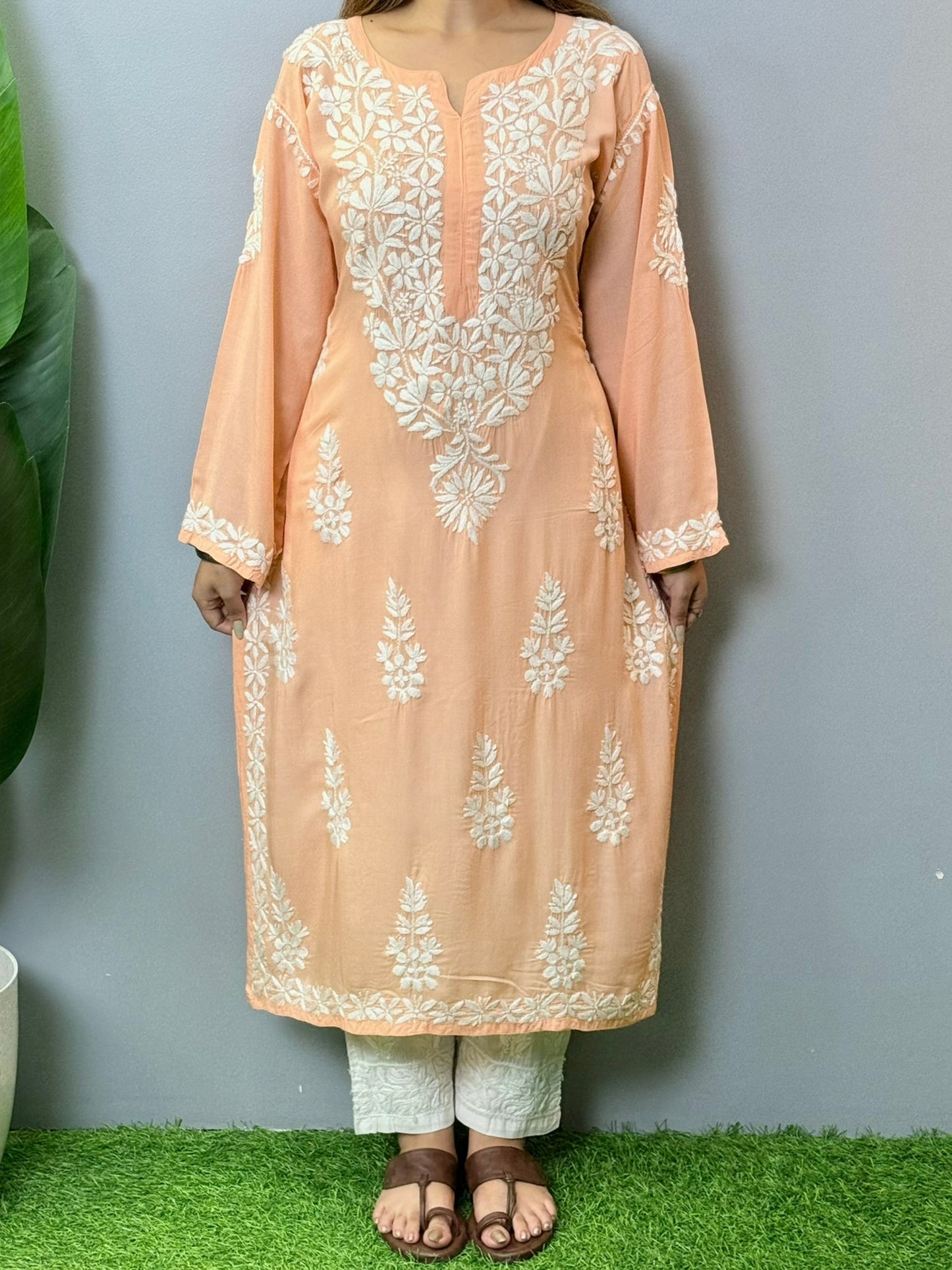 Peach modal kurta featuring intricate white hand Chikankari embroidery