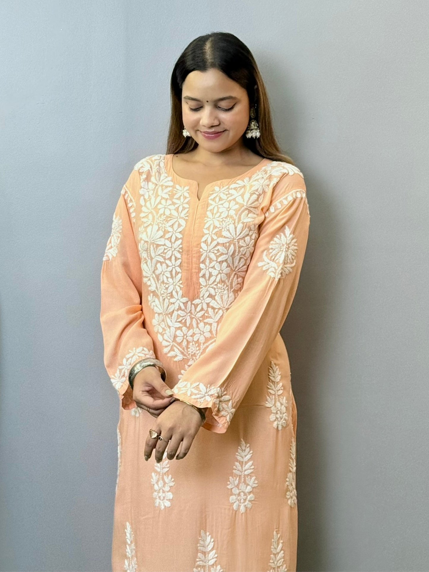Peach modal kurta featuring intricate white hand Chikankari embroidery