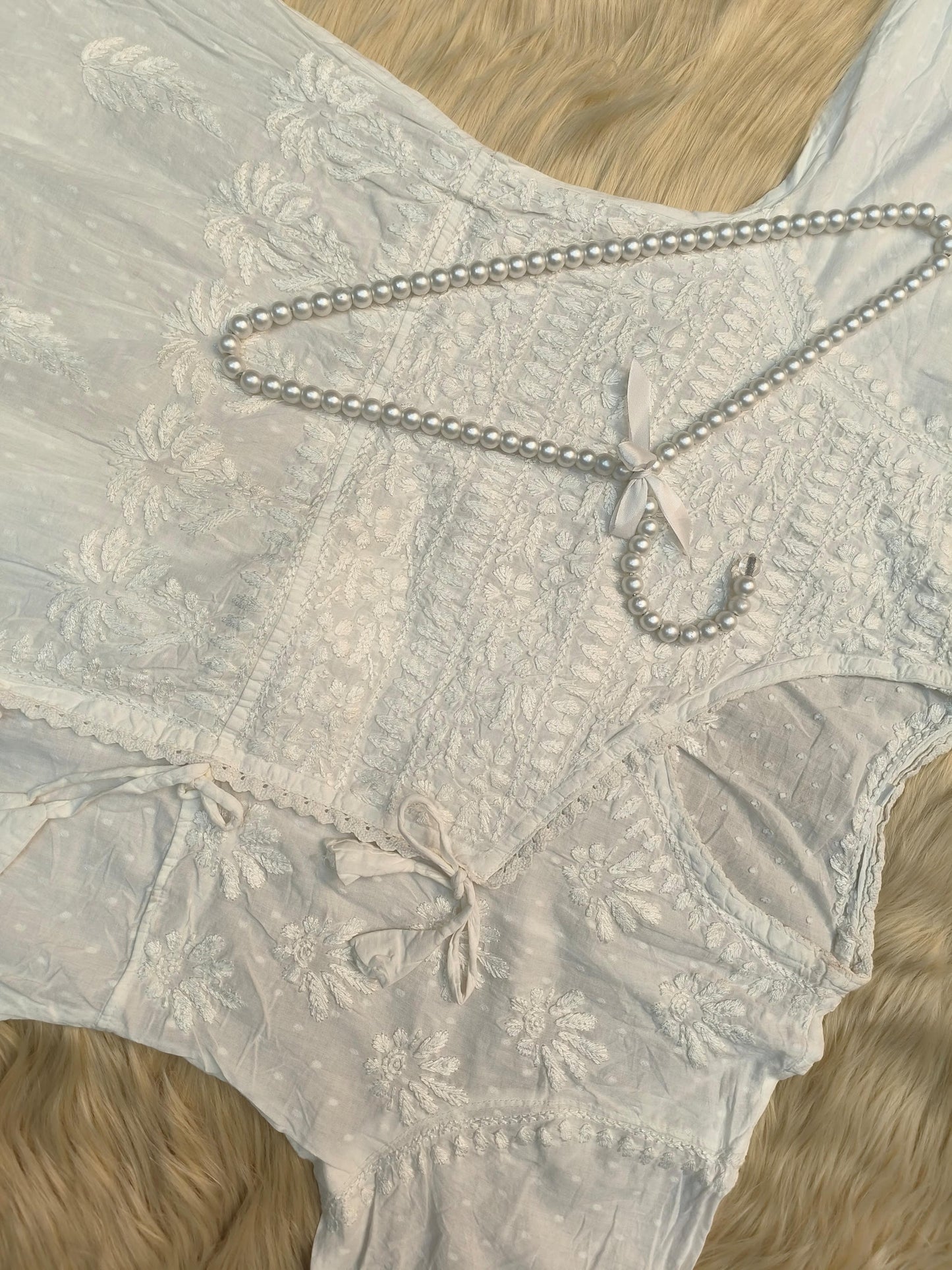 White dobby cotton angrakha chikankari kurta with side tie and hand embroidery