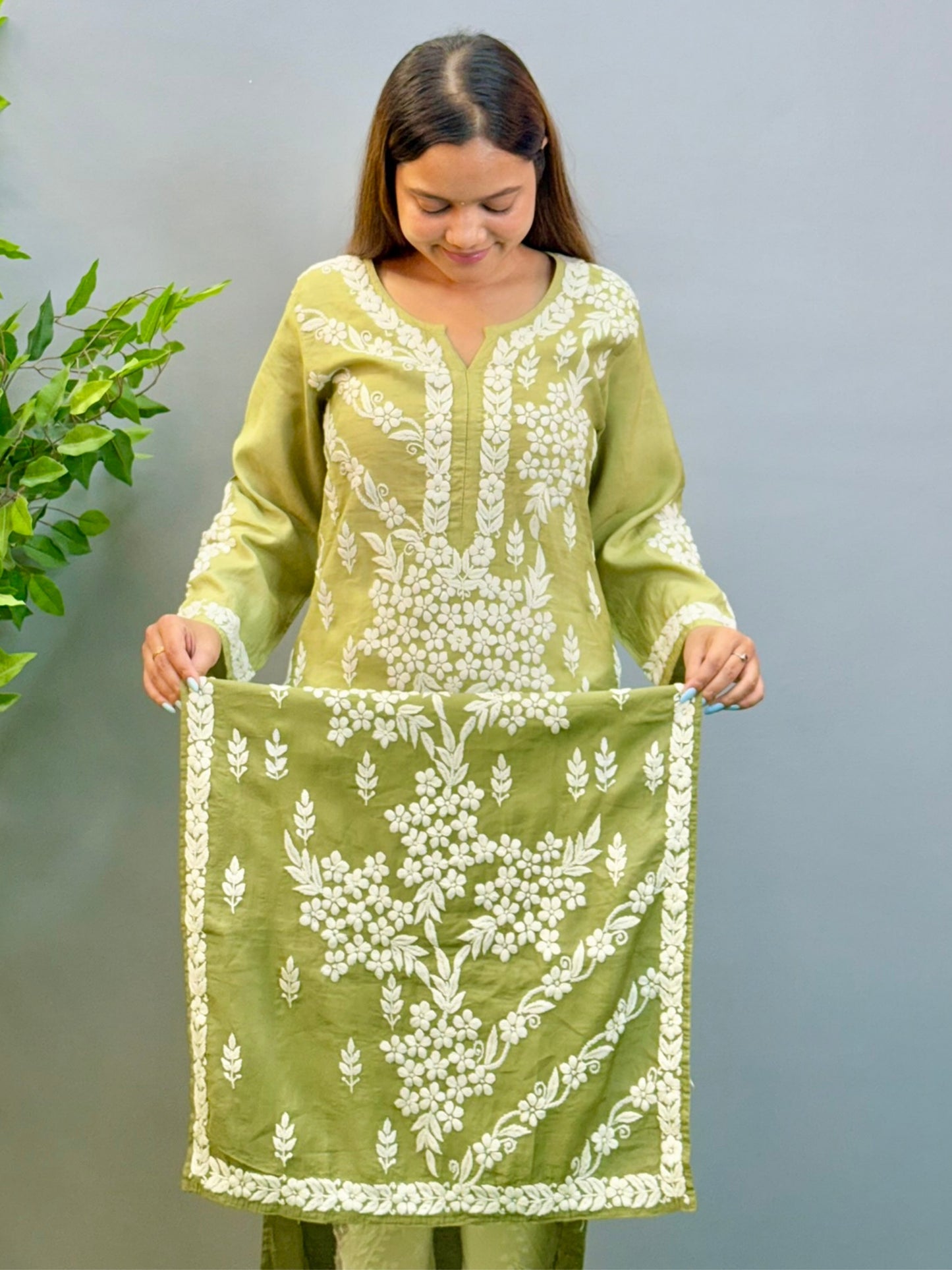 Model wearing ombre olive green chanderi kurta with intricate 3D chikankari floral embroidery.