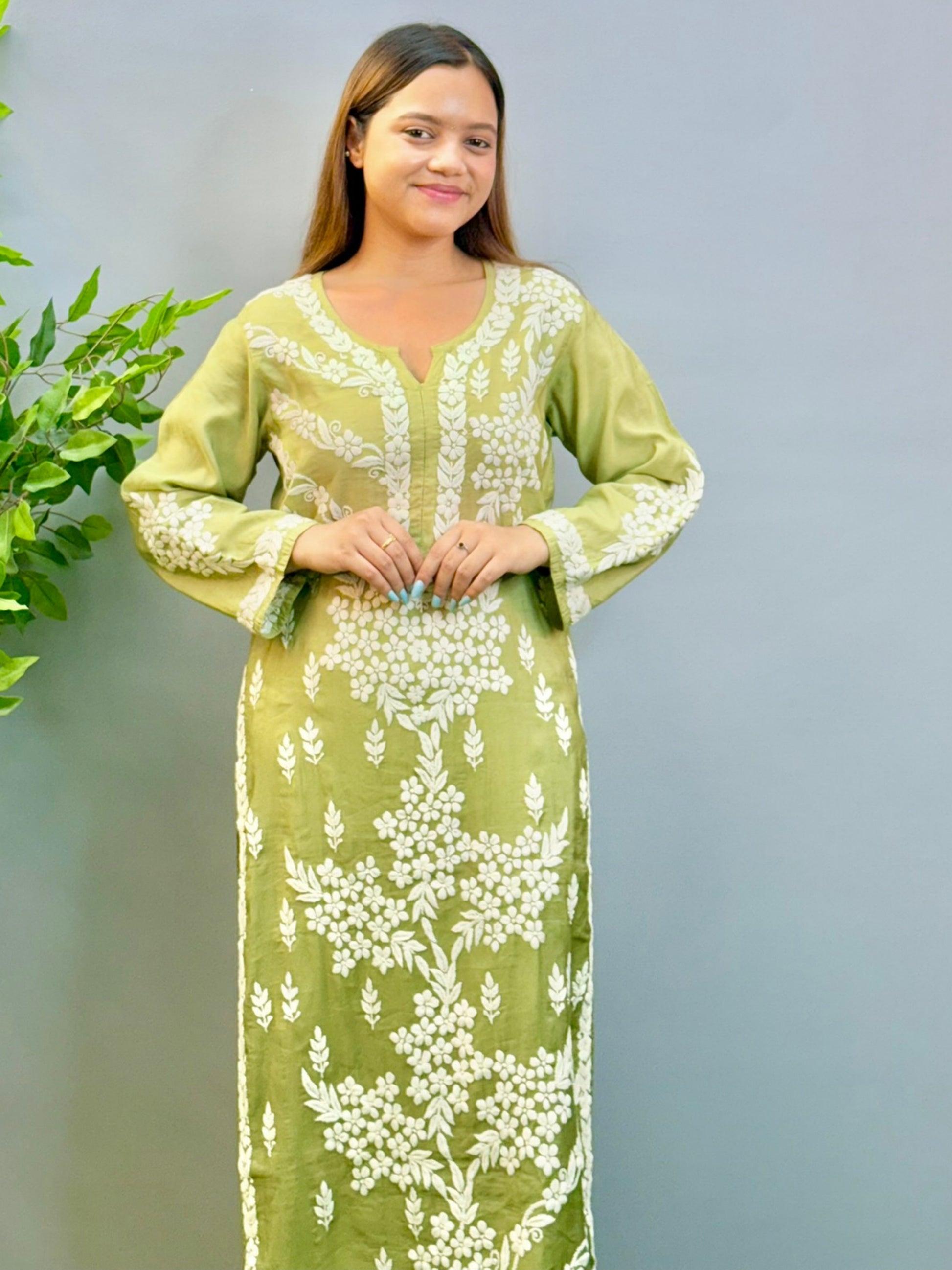 Model wearing ombre olive green chanderi kurta with intricate 3D chikankari floral embroidery.