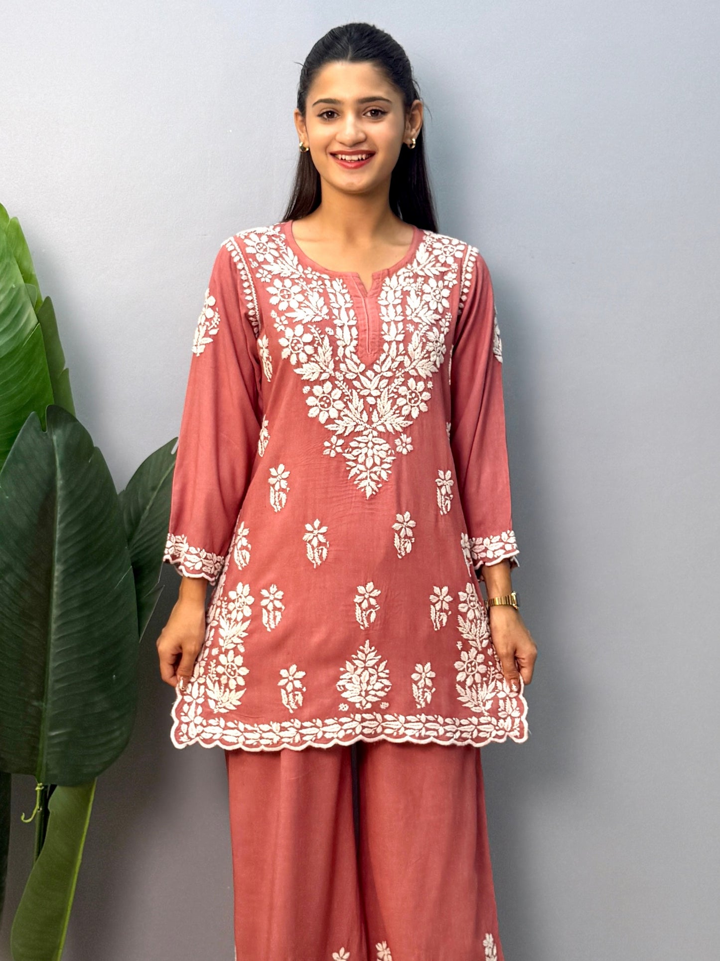 Dusty Rose Lucknow Chikankari rayon short kurta with palazzo pant featuring white hand embroidery.