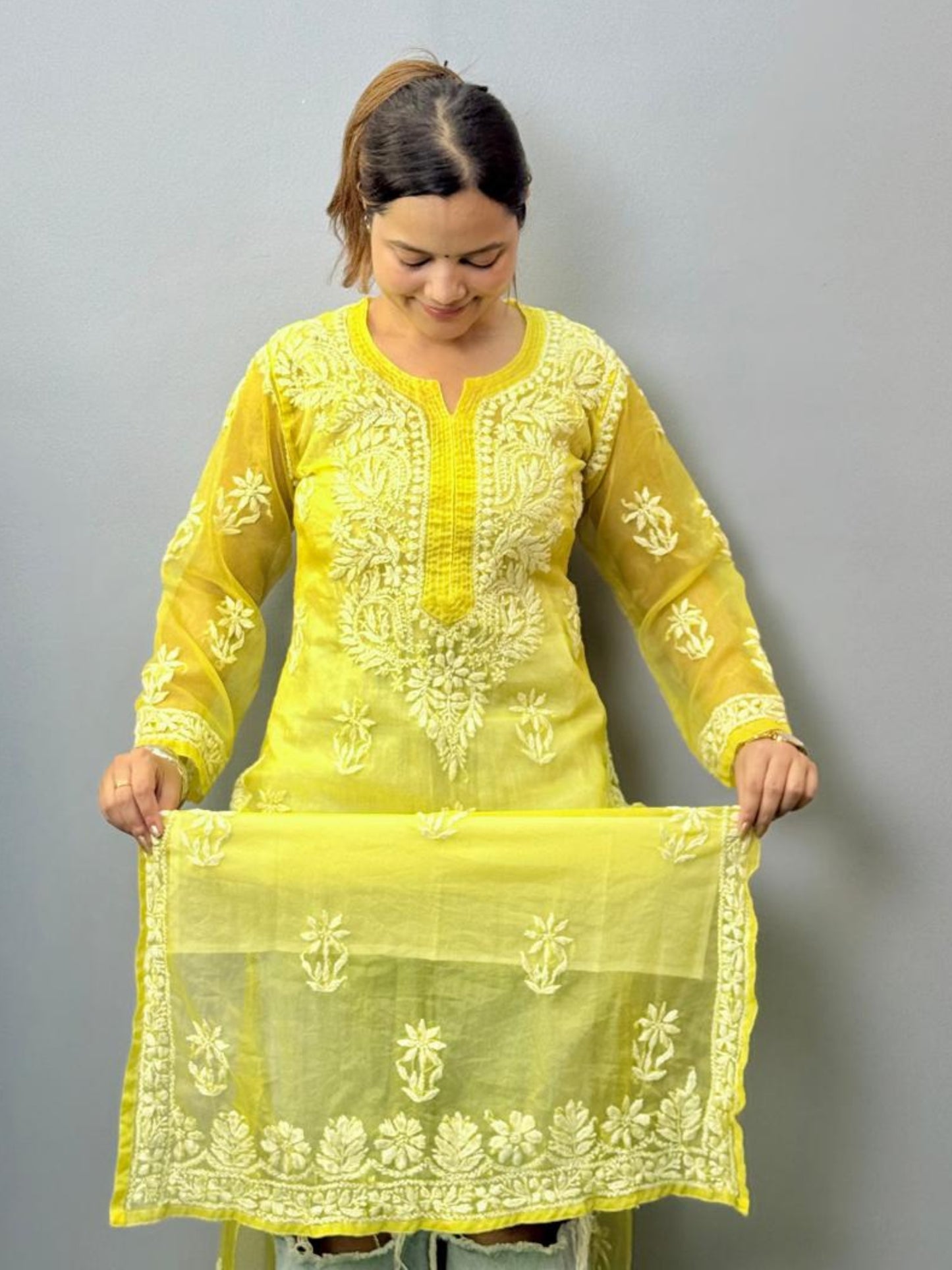 Lemon yellow sheer organza chikankari kurta with hand embroidery in white thread