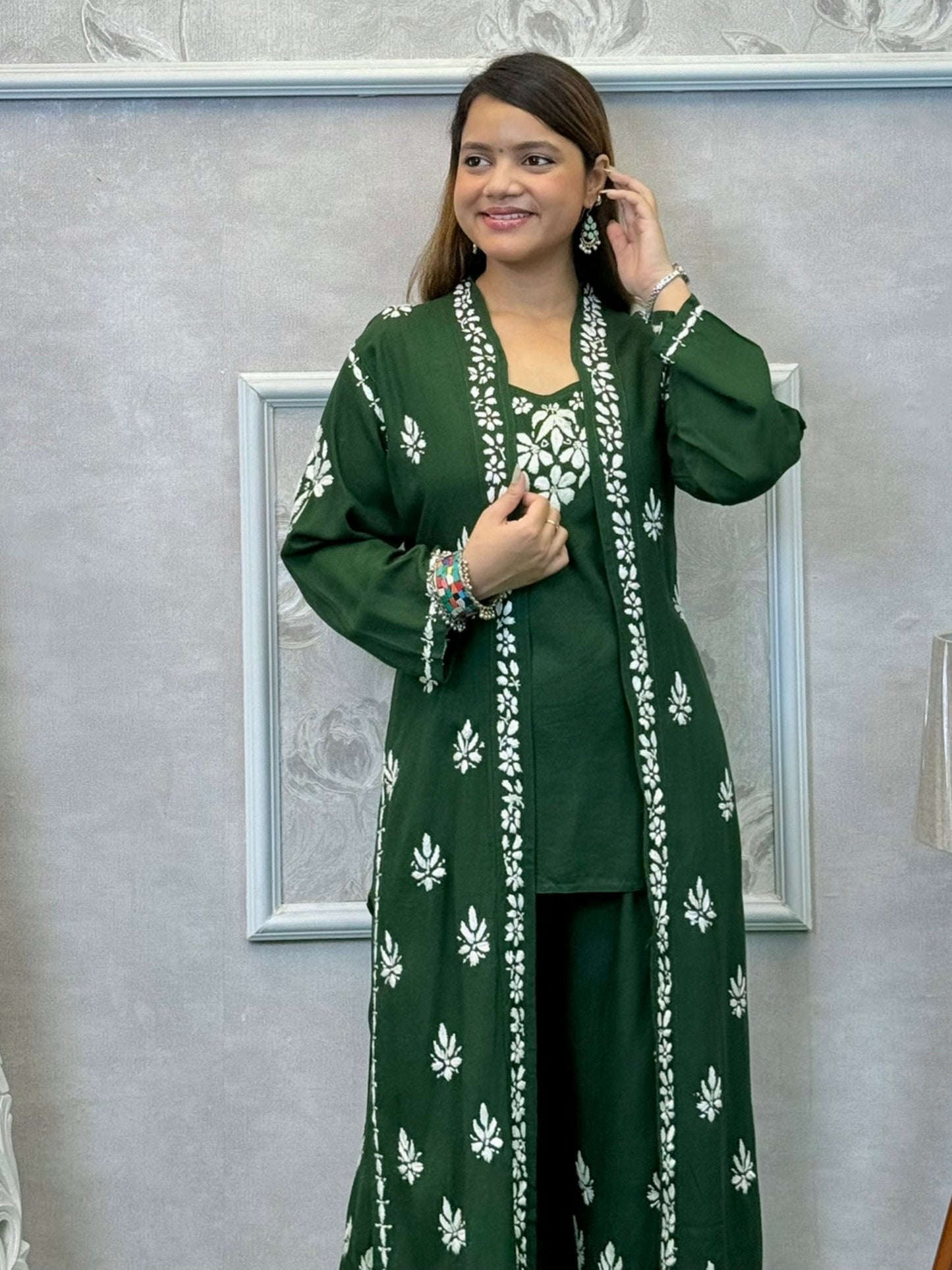 Dark green Lucknowi Chikankari 3-piece rayon set with sleeveless kurta, embroidered shrug, and pants