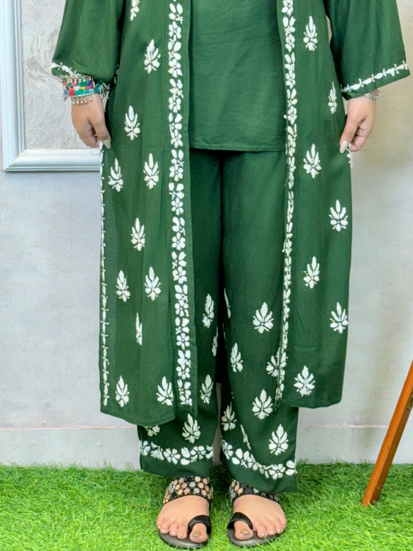 Dark green Lucknowi Chikankari 3-piece rayon set with sleeveless kurta, embroidered shrug, and pants