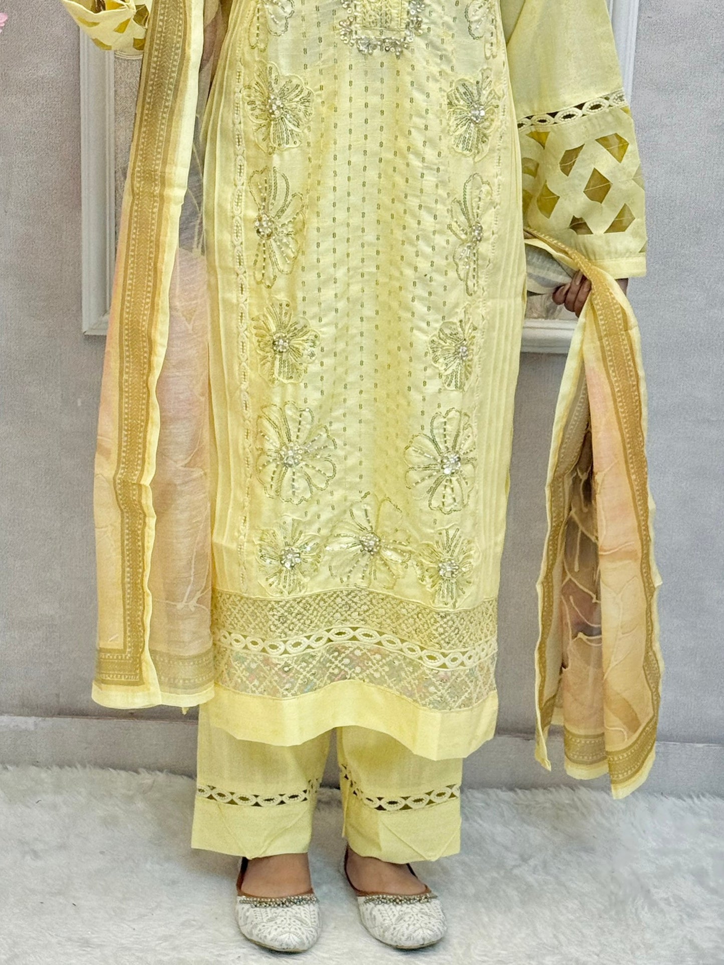 Lemon yellow rayon kurta set with hand embroidery and mirror work, printed dupatta, and matching pants