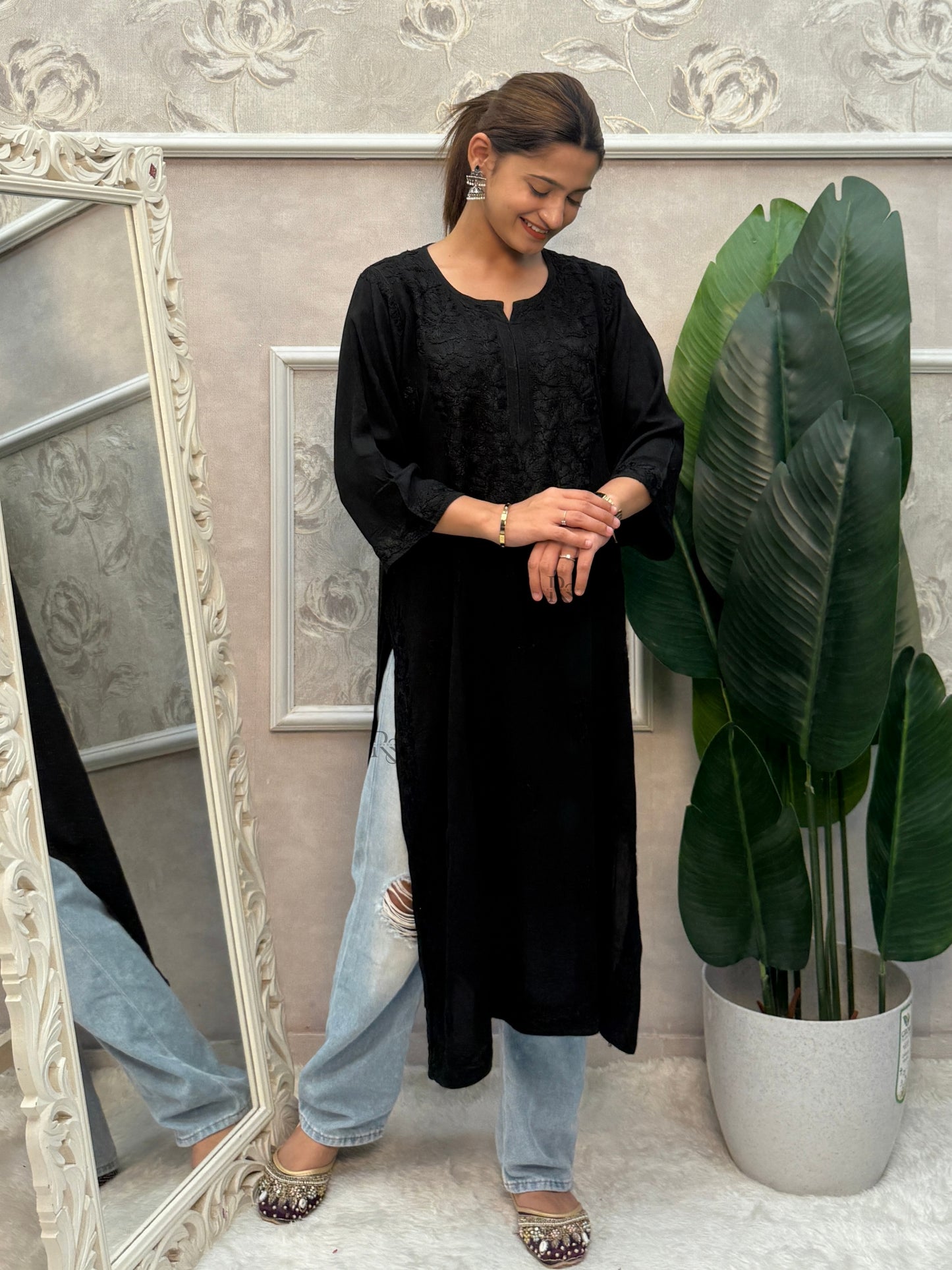 Black rayon Lucknow Chikankari kurta with delicate hand embroidery.