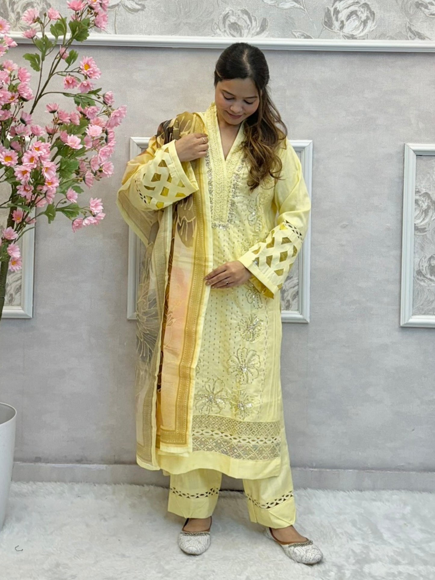 Lemon yellow rayon kurta set with hand embroidery and mirror work, printed dupatta, and matching pants