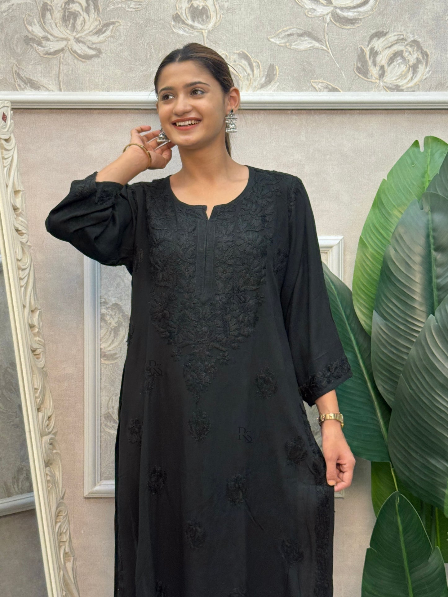 Black rayon Lucknow Chikankari kurta with delicate hand embroidery.