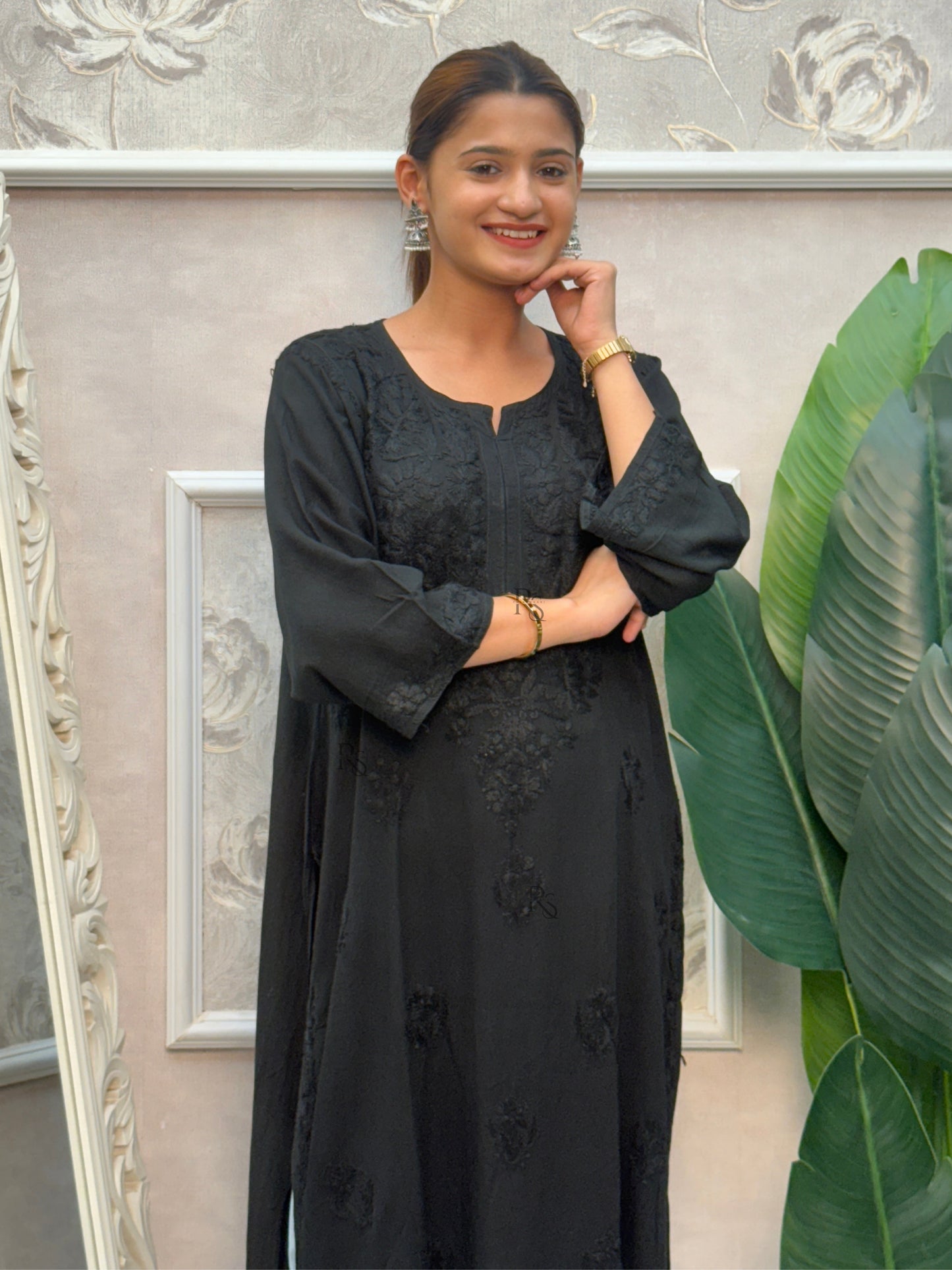 Black rayon Lucknow Chikankari kurta with delicate hand embroidery.
