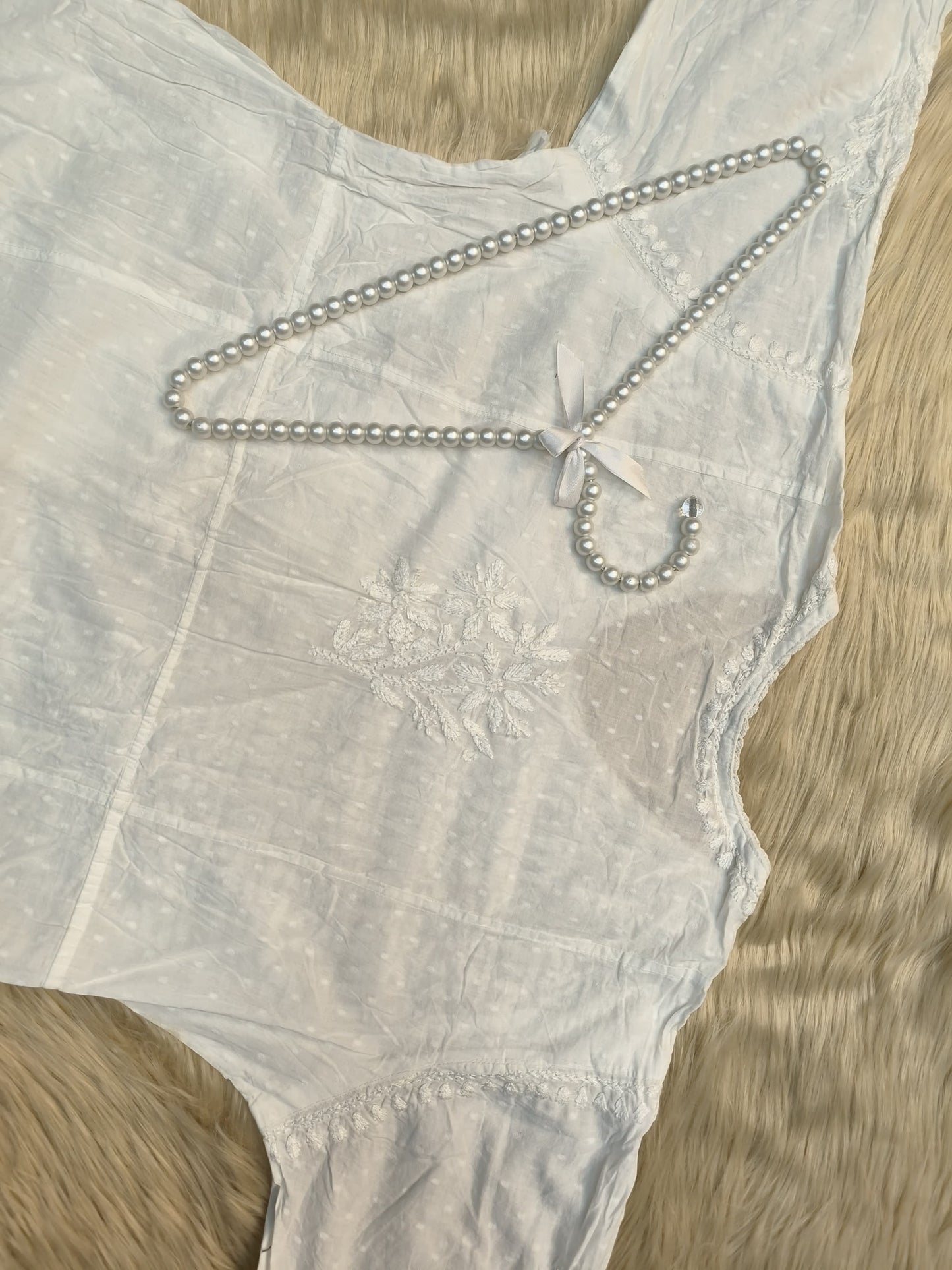 White dobby cotton angrakha chikankari kurta with side tie and hand embroidery