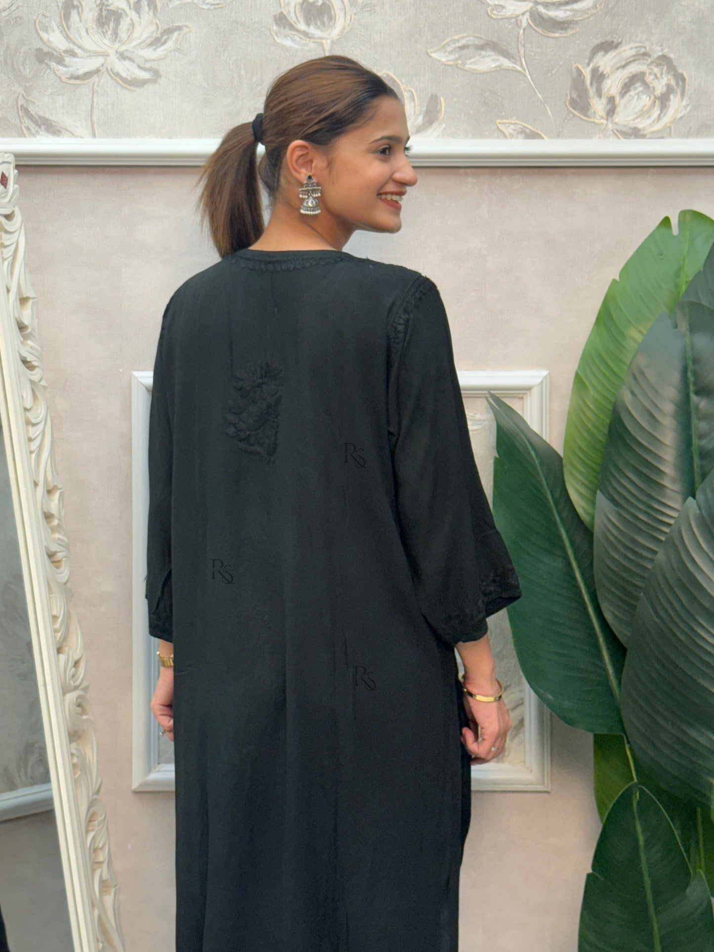 Black rayon Lucknow Chikankari kurta with delicate hand embroidery.