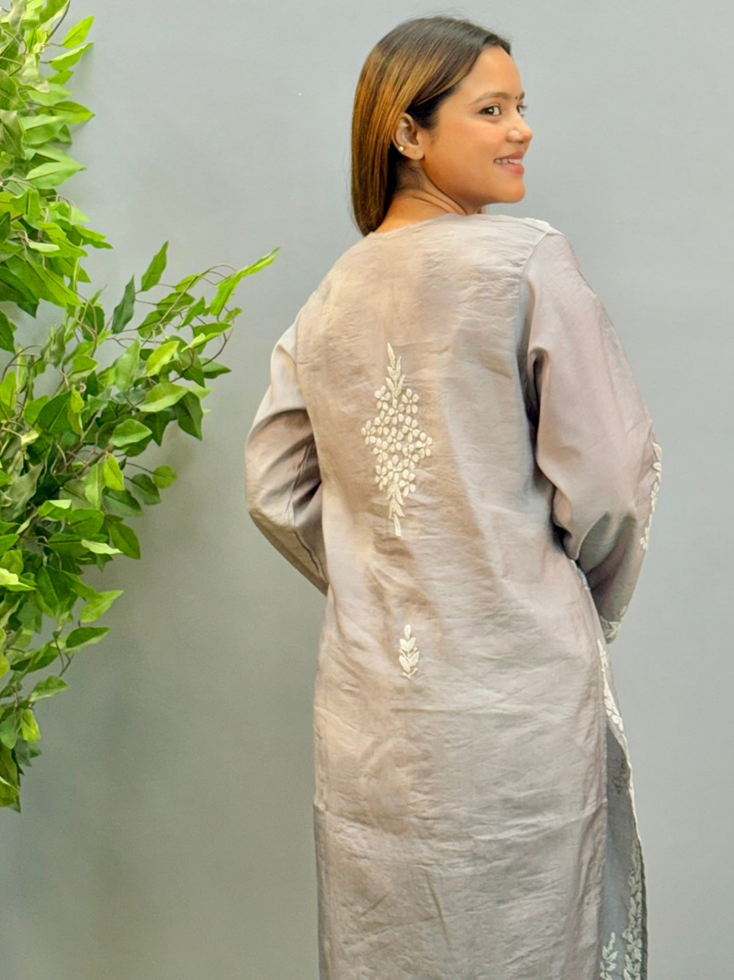 Model wearing ombre grey Chanderi chikankari kurta with intricate white 3D embroidery.
