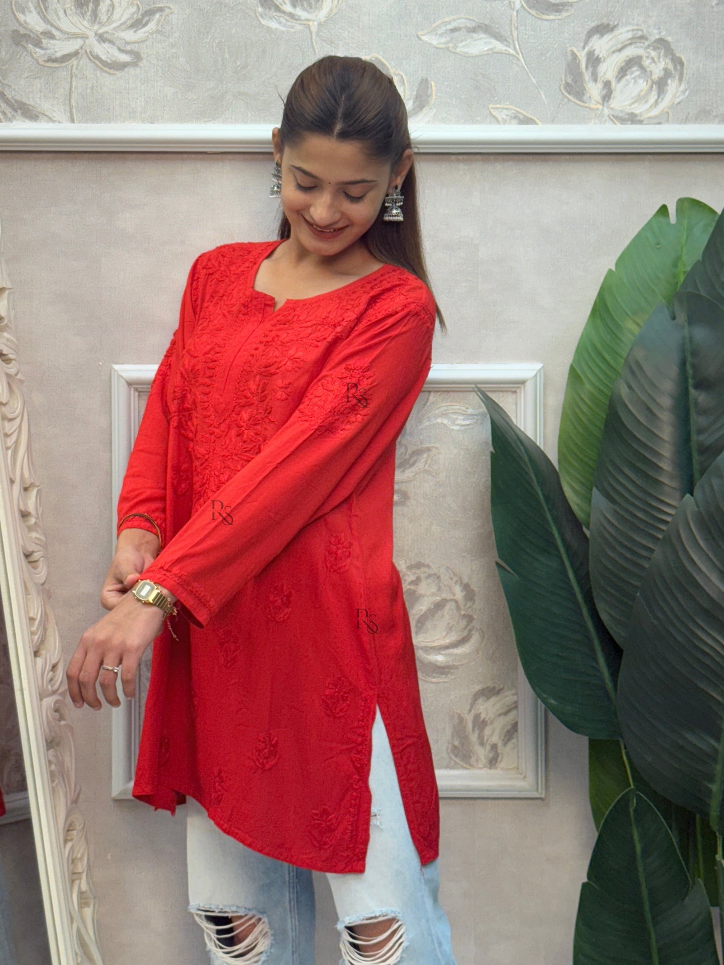 Red rayon Lucknow Chikankari short kurta with delicate hand embroidery.