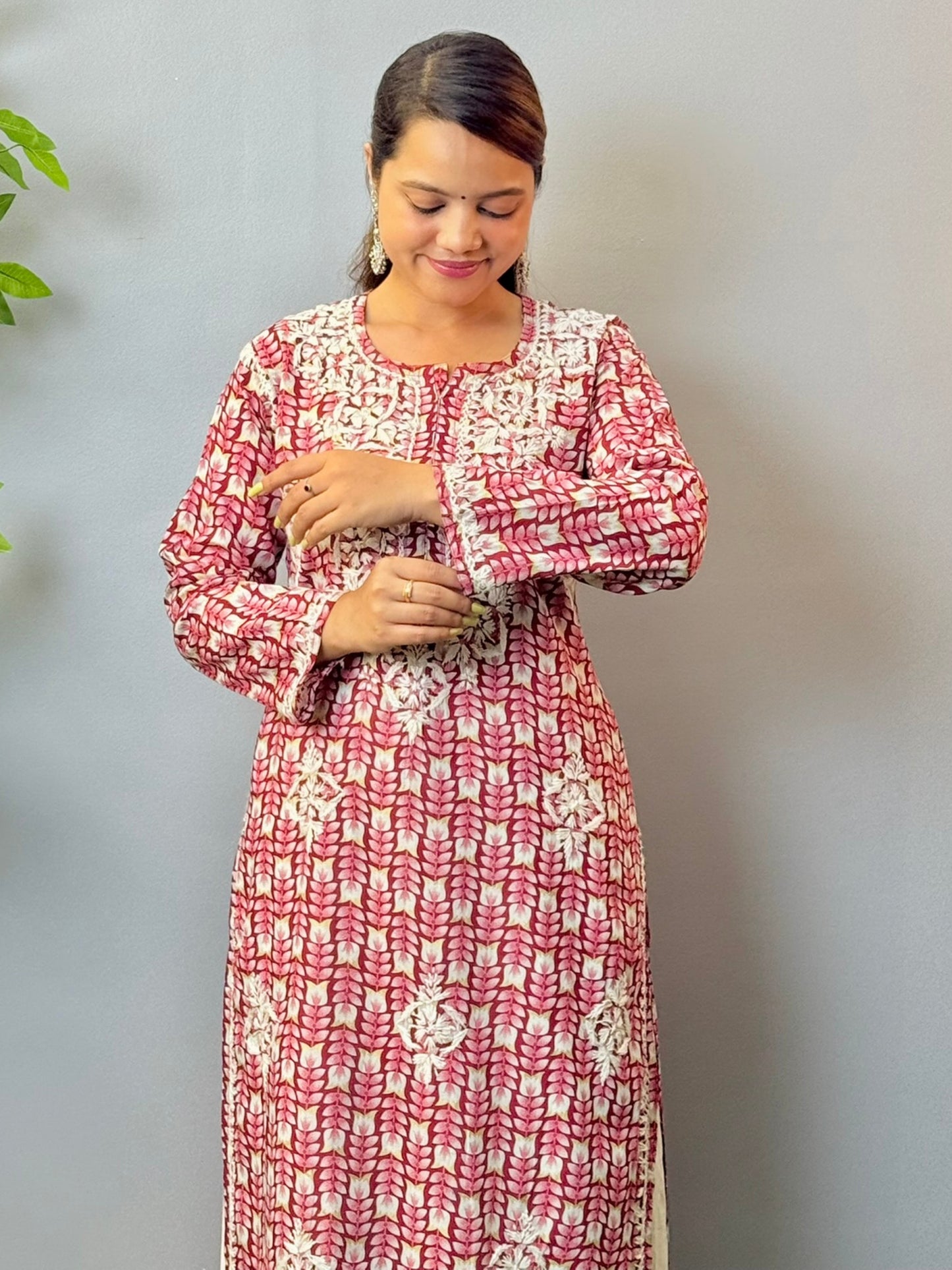 Woman in maroon printed mulmul chikankari kurta with white thread embroidery