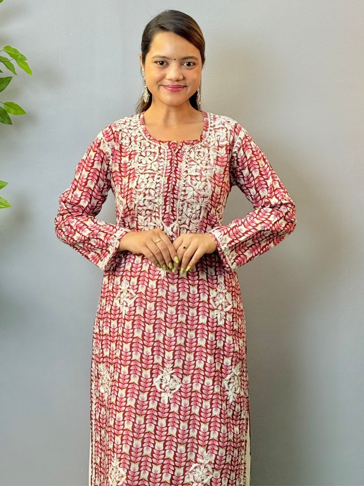Woman in maroon printed mulmul chikankari kurta with white thread embroidery