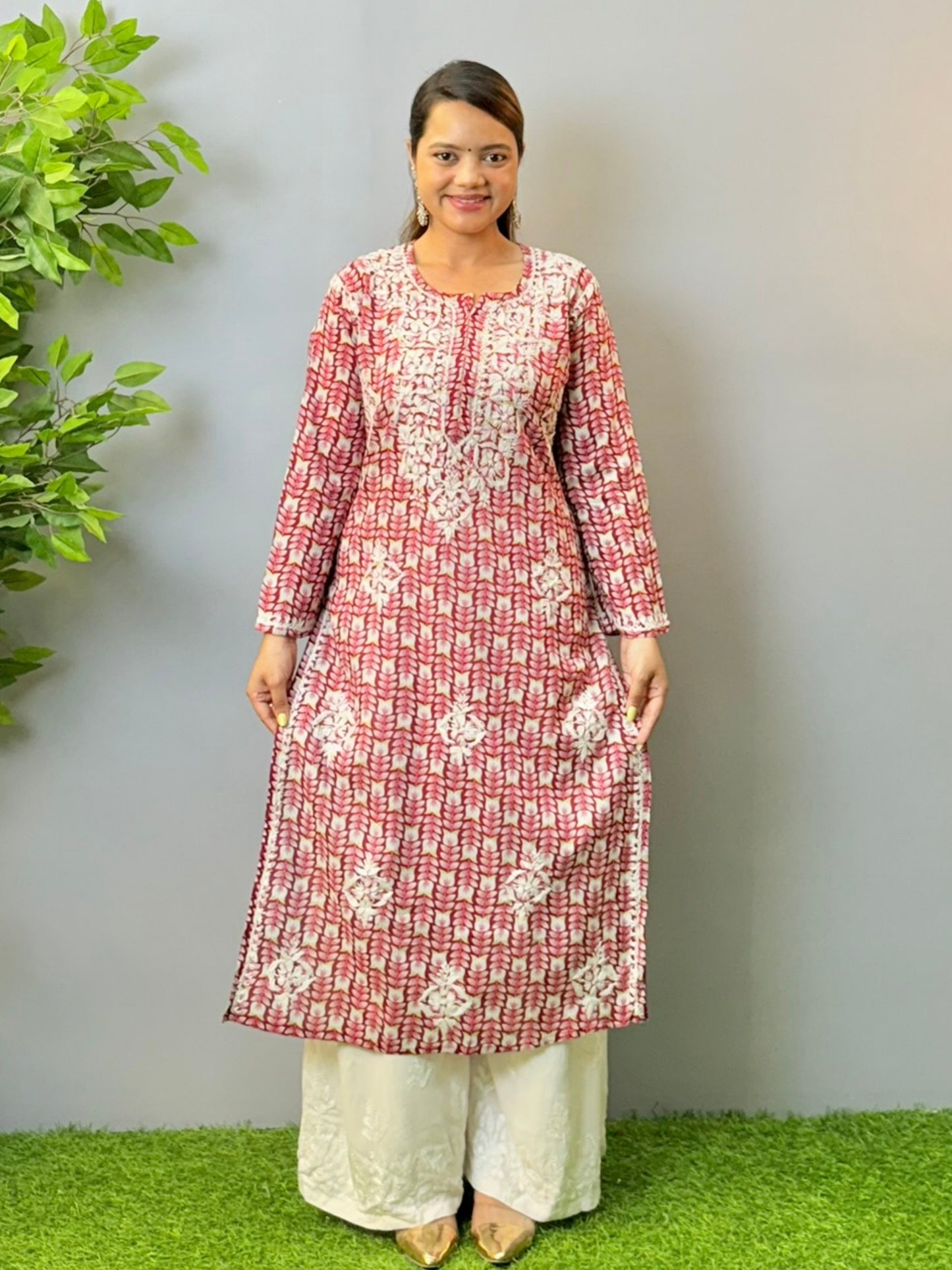 Woman in maroon printed mulmul chikankari kurta with white thread embroidery