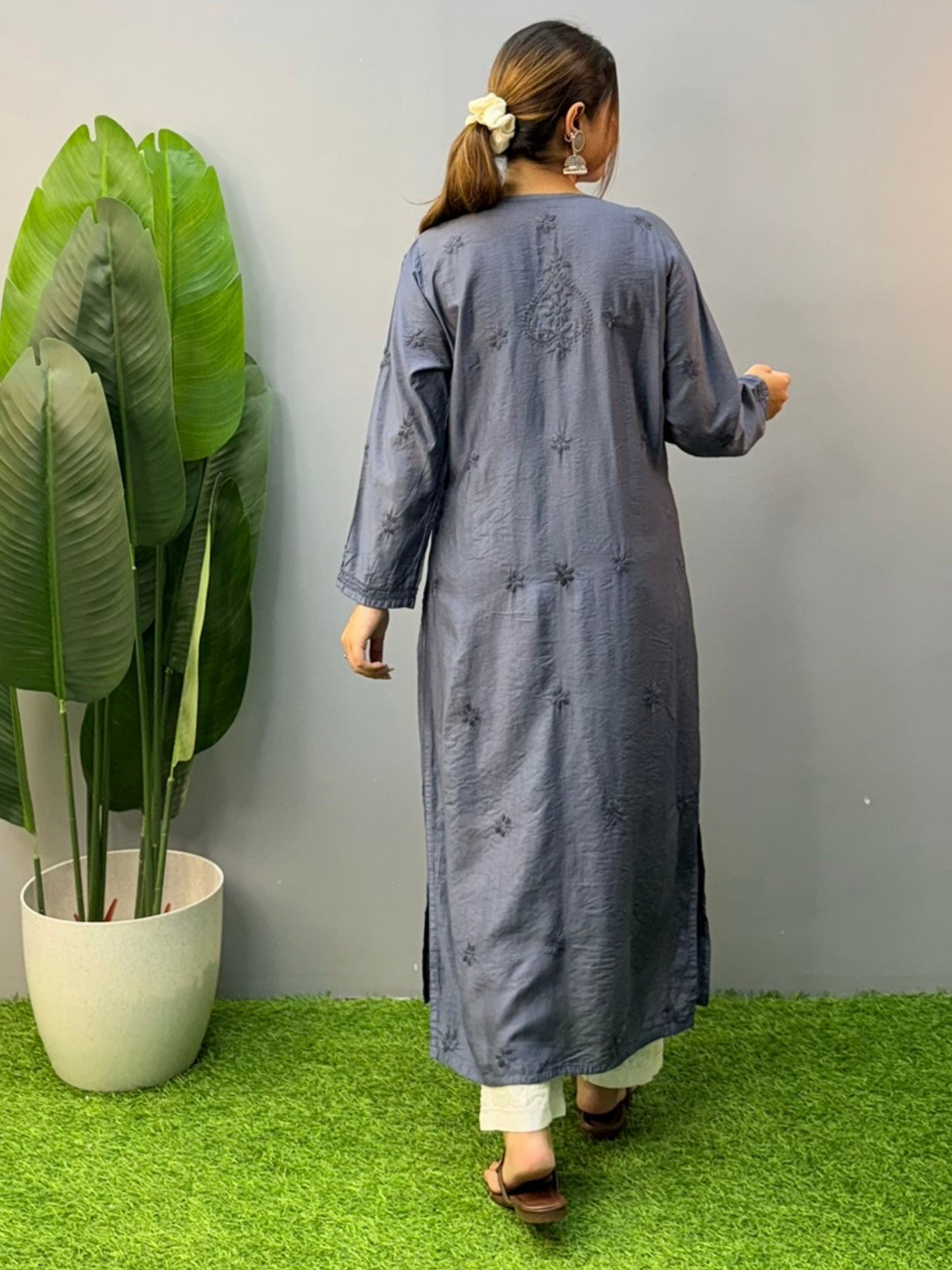 Model wearing steel grey hand-embroidered Chanderi chikankari kurta with delicate motifs
