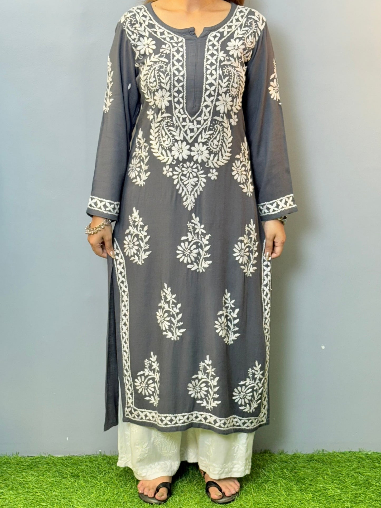 Woman wearing charcoal grey rayon chikankari kurta with white hand embroidery