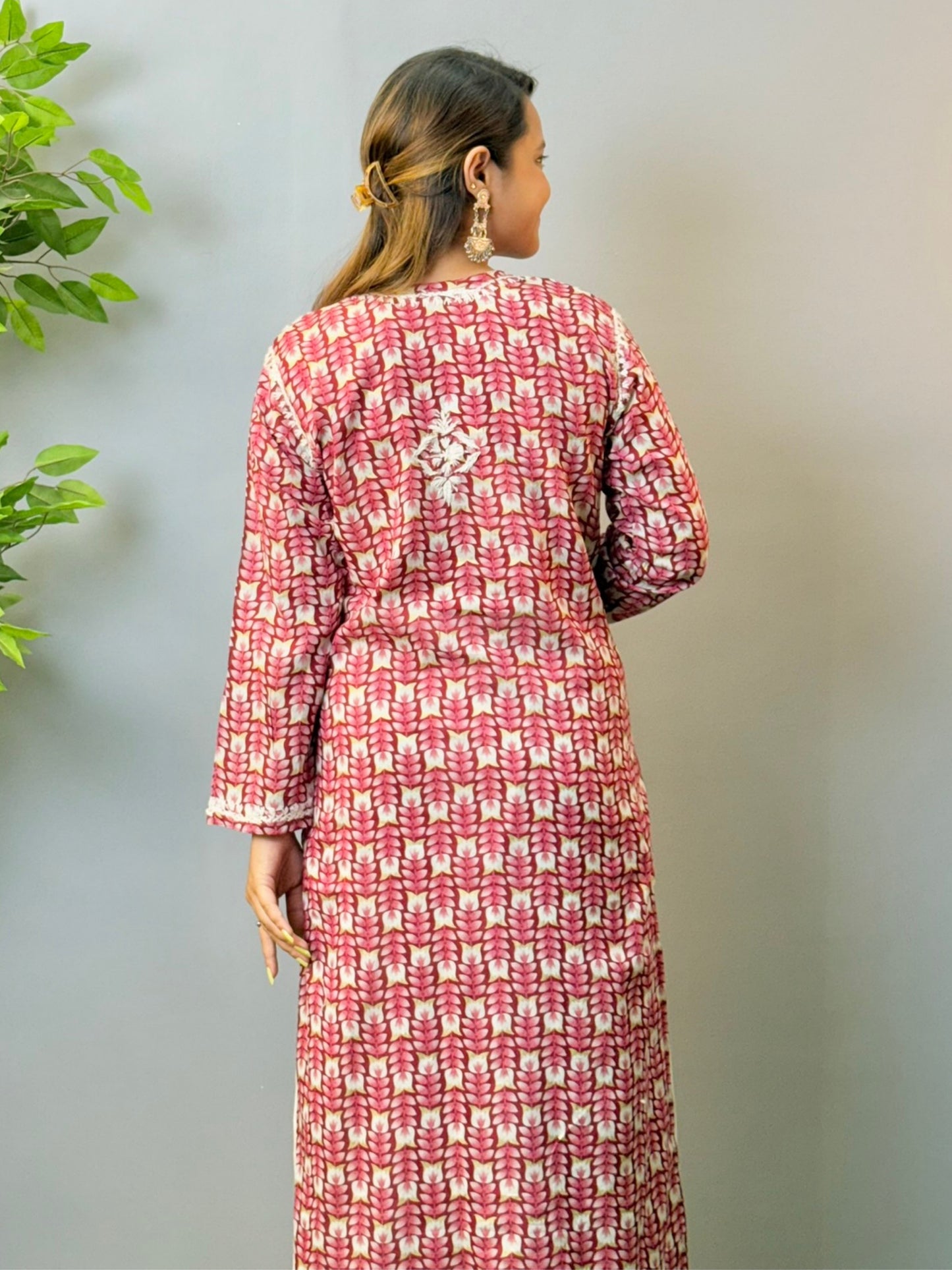 Woman in maroon printed mulmul chikankari kurta with white thread embroidery