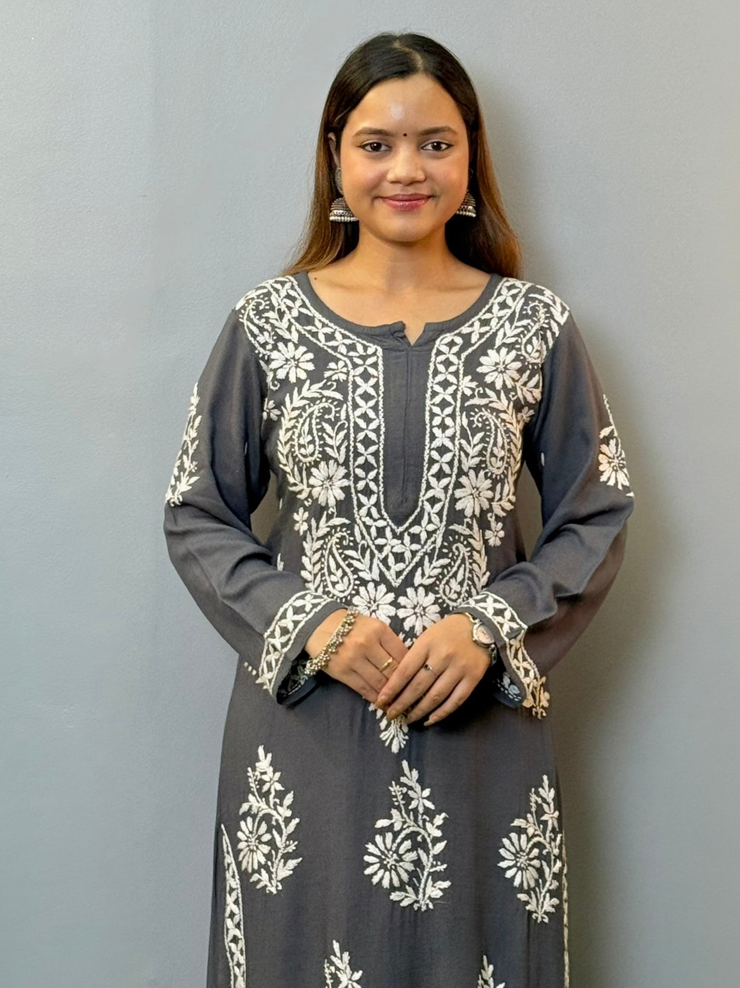 Woman wearing charcoal grey rayon chikankari kurta with white hand embroidery