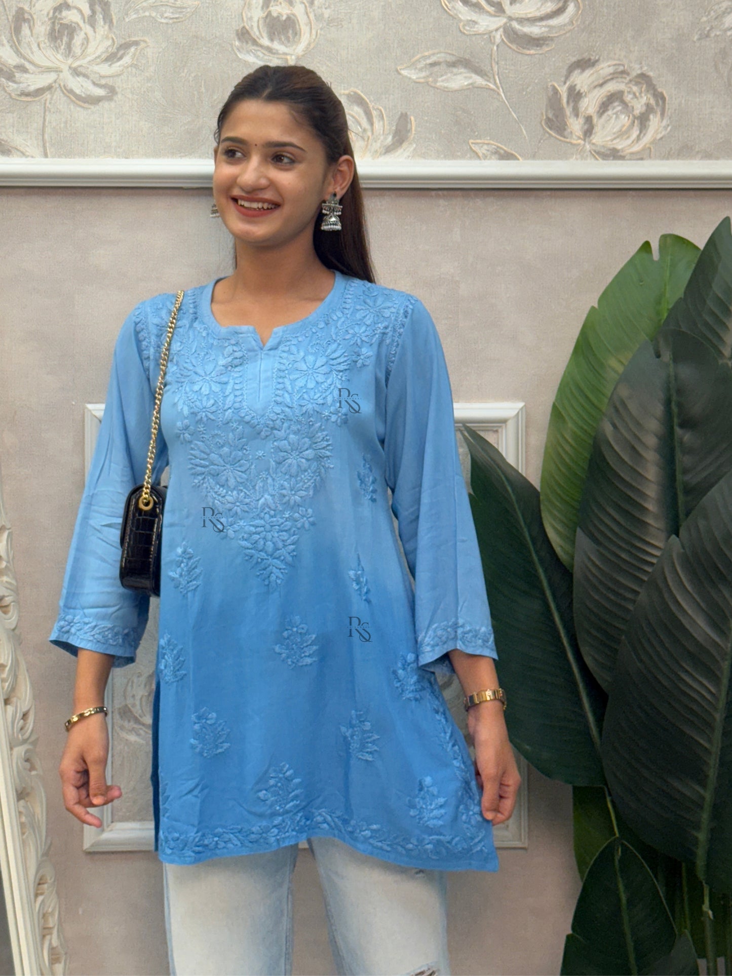 Blue rayon Lucknow Chikankari short kurta with delicate hand embroidery.